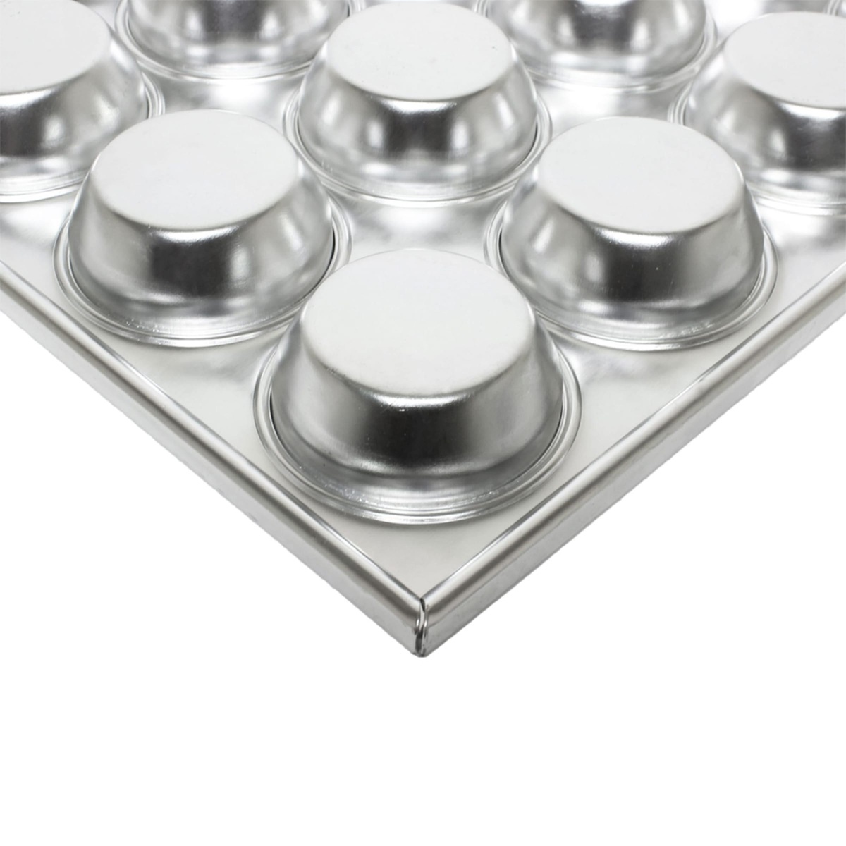 Corner detail of the muffin pan showing rolled reinforced edges and seamless cup construction
