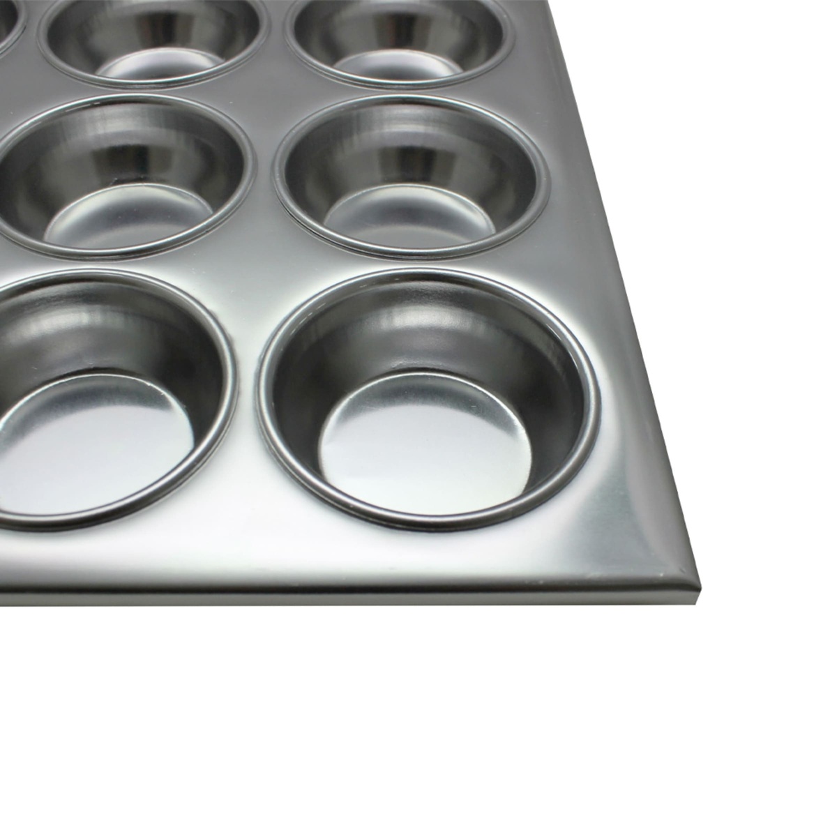 Close-up of seamless aluminum muffin cup wells showing smooth interior finish