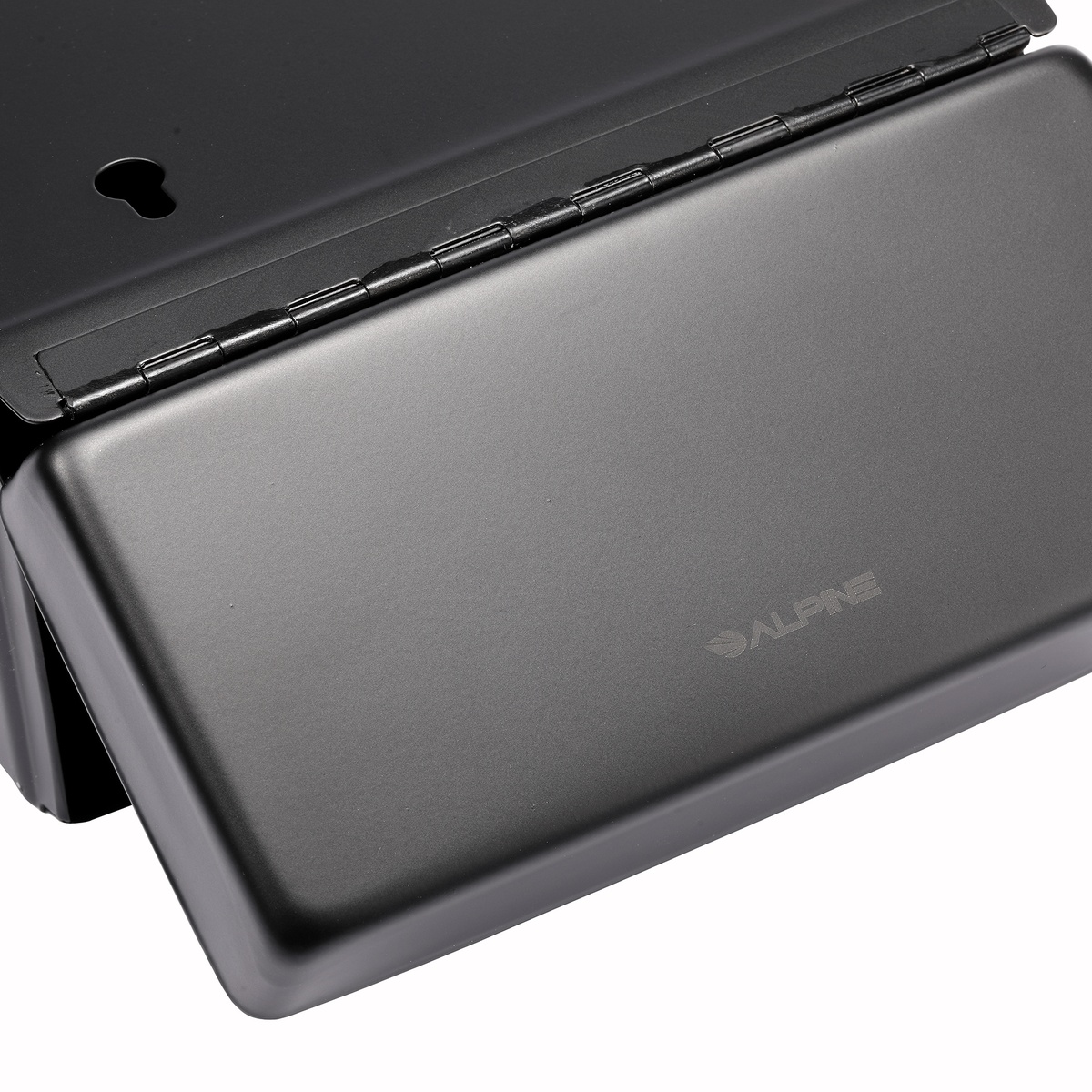 Close-up of flip-top lid and hinge on sanitary napkin receptacle