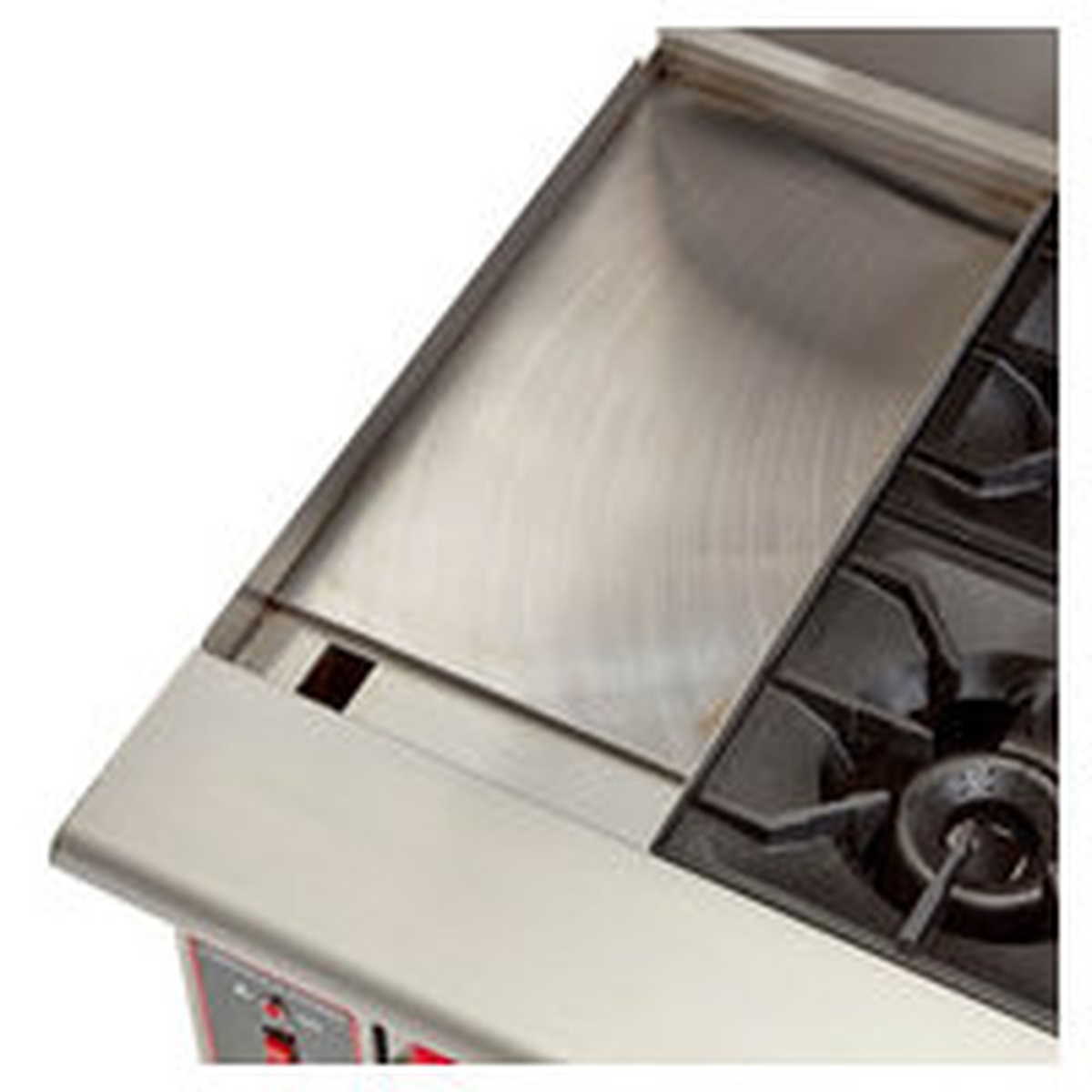 Close-up of the 24 inch polished steel griddle plate on the left side of the range