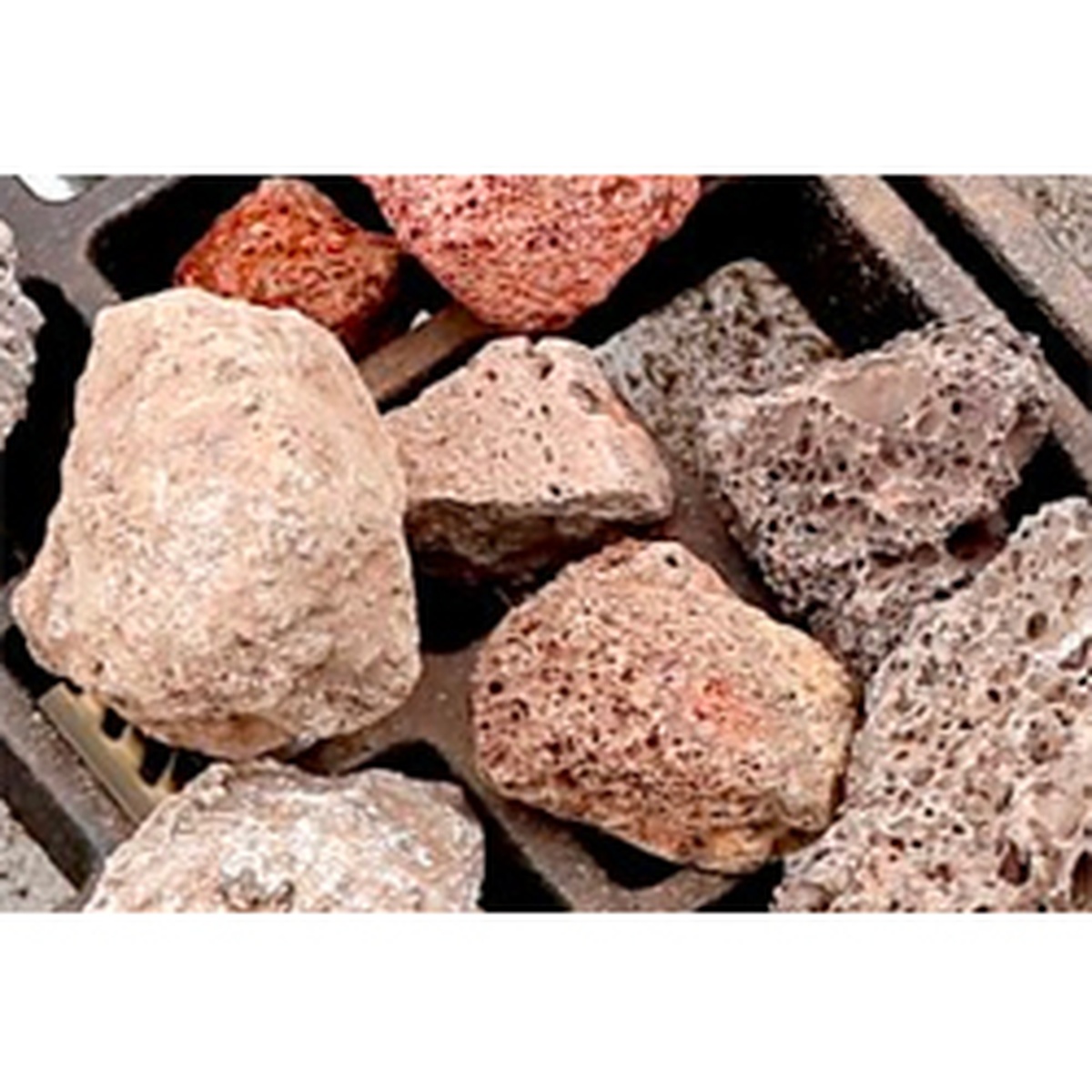 Close-up of lava briquettes used in a char rock broiler