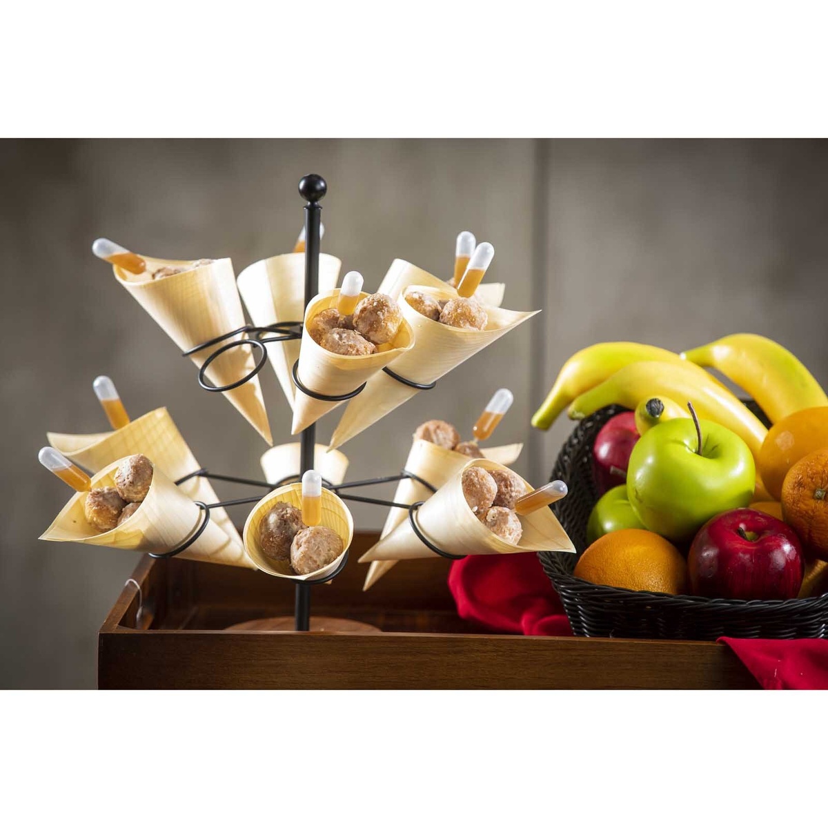Wooden cones used to serve savory meatballs with sauce pipettes