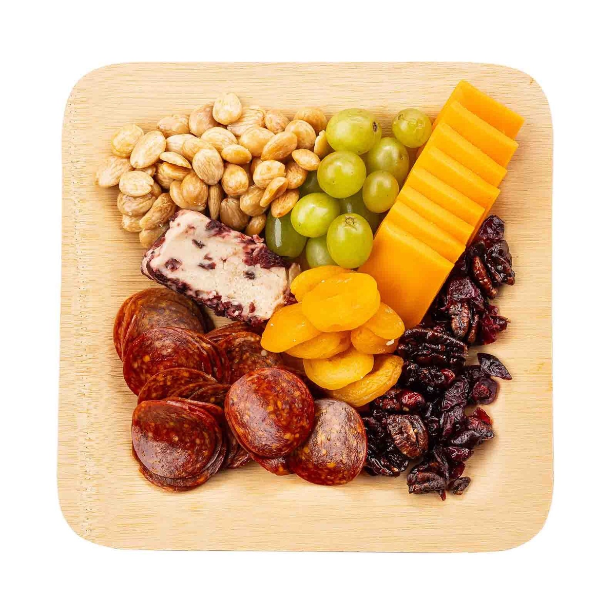 10-inch square bamboo plate loaded with charcuterie, nuts, grapes, dried fruit, and cheese