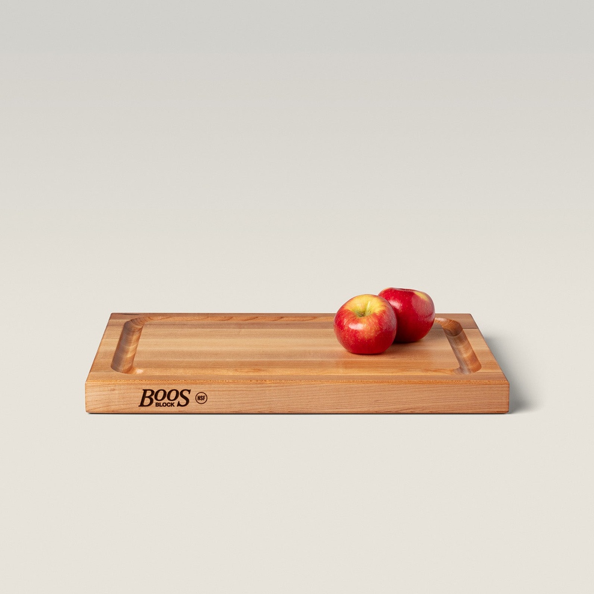 Angled side view of the John Boos BBQBD cutting board with Boos Block NSF branding on the edge