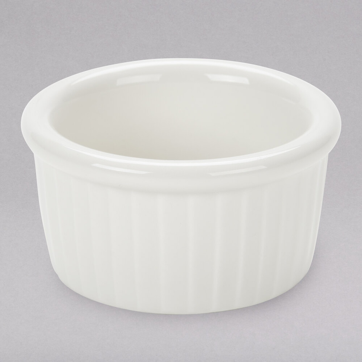 Tuxton BEX-0252 2.5 oz. eggshell fluted china ramekin, round with classic ribbed exterior