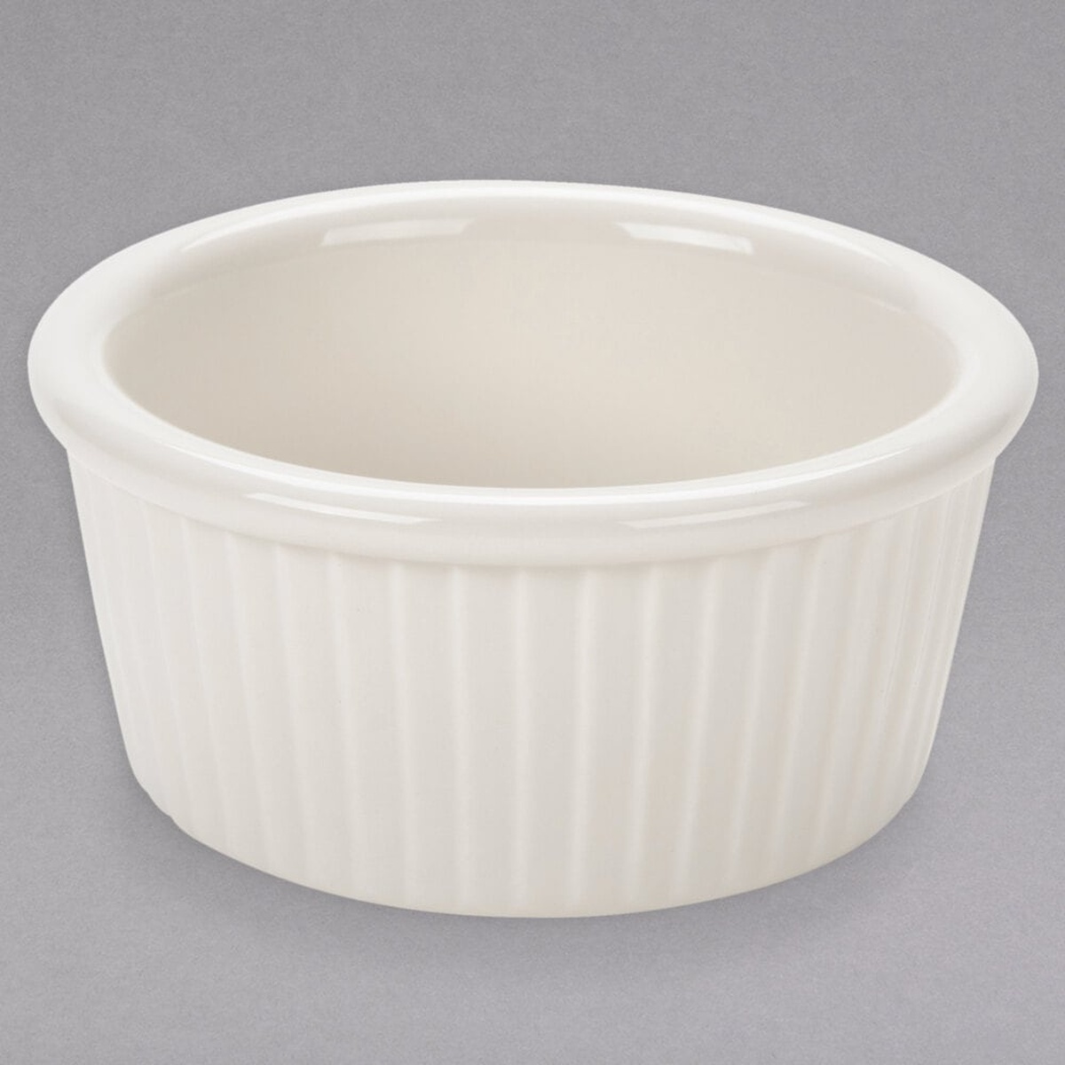 Tuxton BEX-0602 6 oz. eggshell fluted china ramekin, round shape with vertical fluting and wide rolled rim