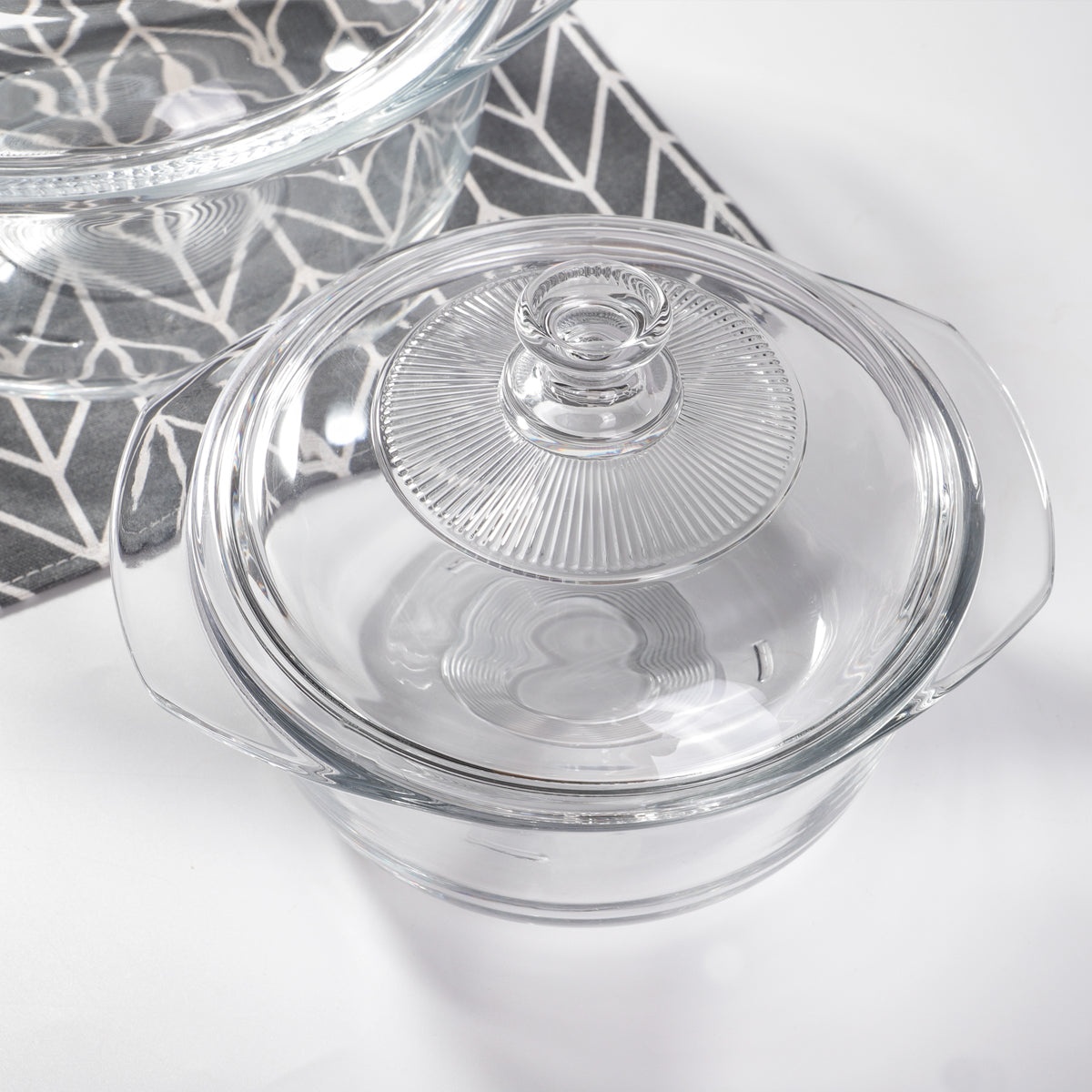 Close-up overhead view of the Enhanced glass pot bowl with lid fitted, highlighting the detailed ribbed lid and clear glass bowl