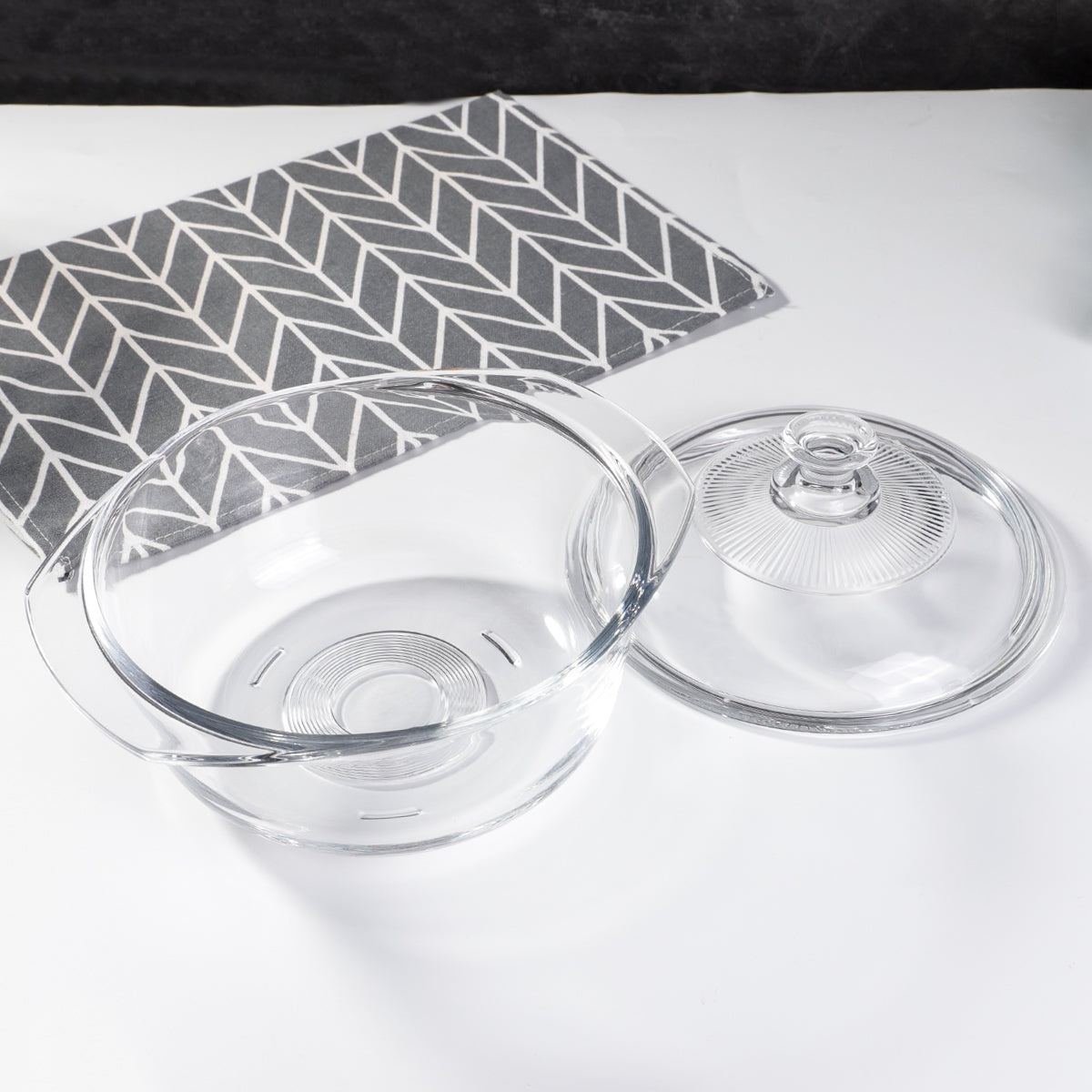 Enhanced glass pot bowl and lid shown side by side, displaying the open bowl interior and ribbed lid detail