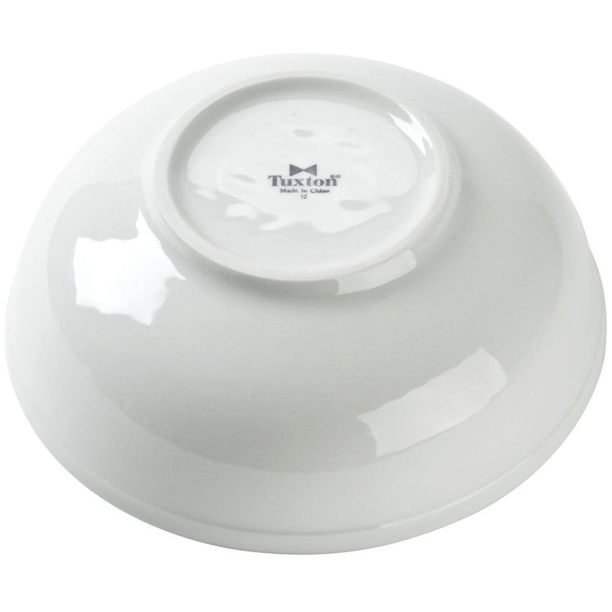 Bottom of the Tuxton BPB-7003 bowl showing the Tuxton brand mark
