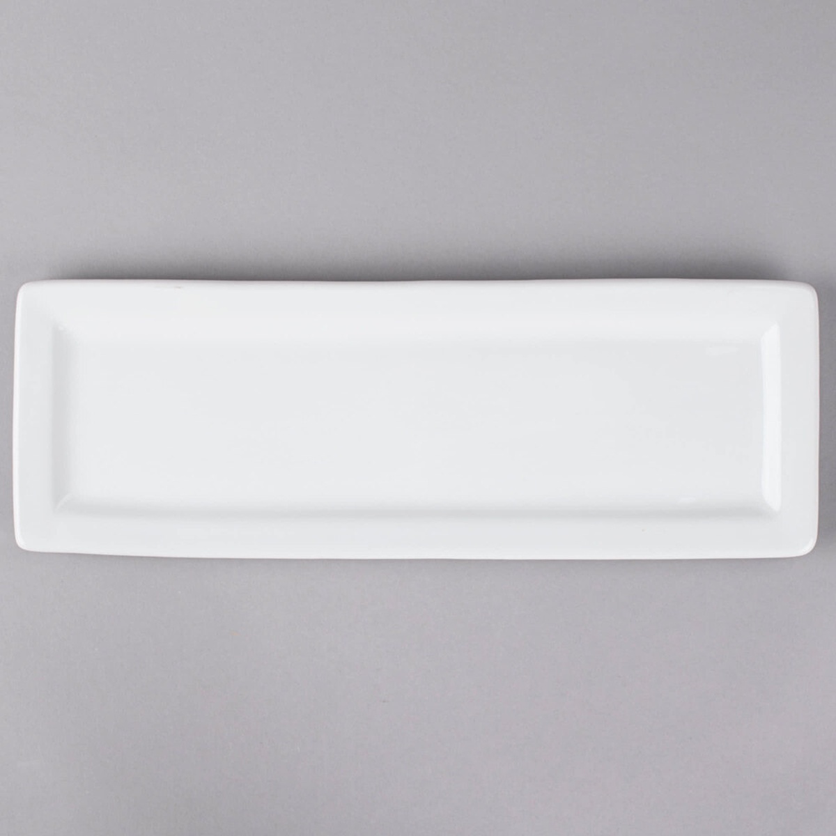 Tuxton white rectangular china platter, top-down view showing raised edges and smooth surface