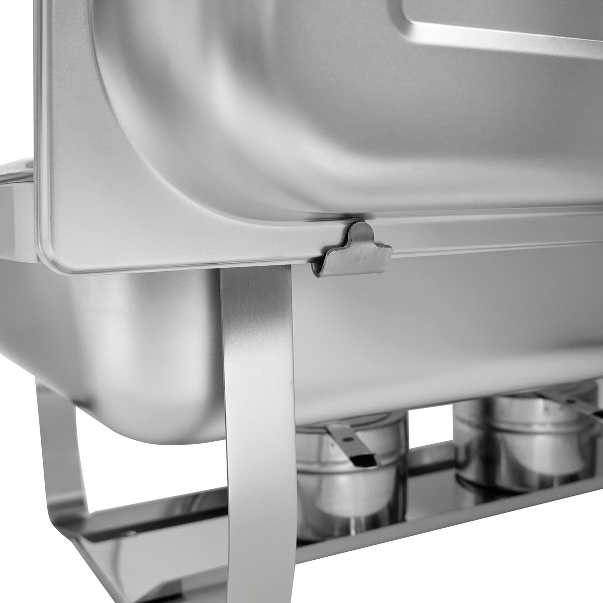Close-up of built-in lid holding clip on stainless steel chafer