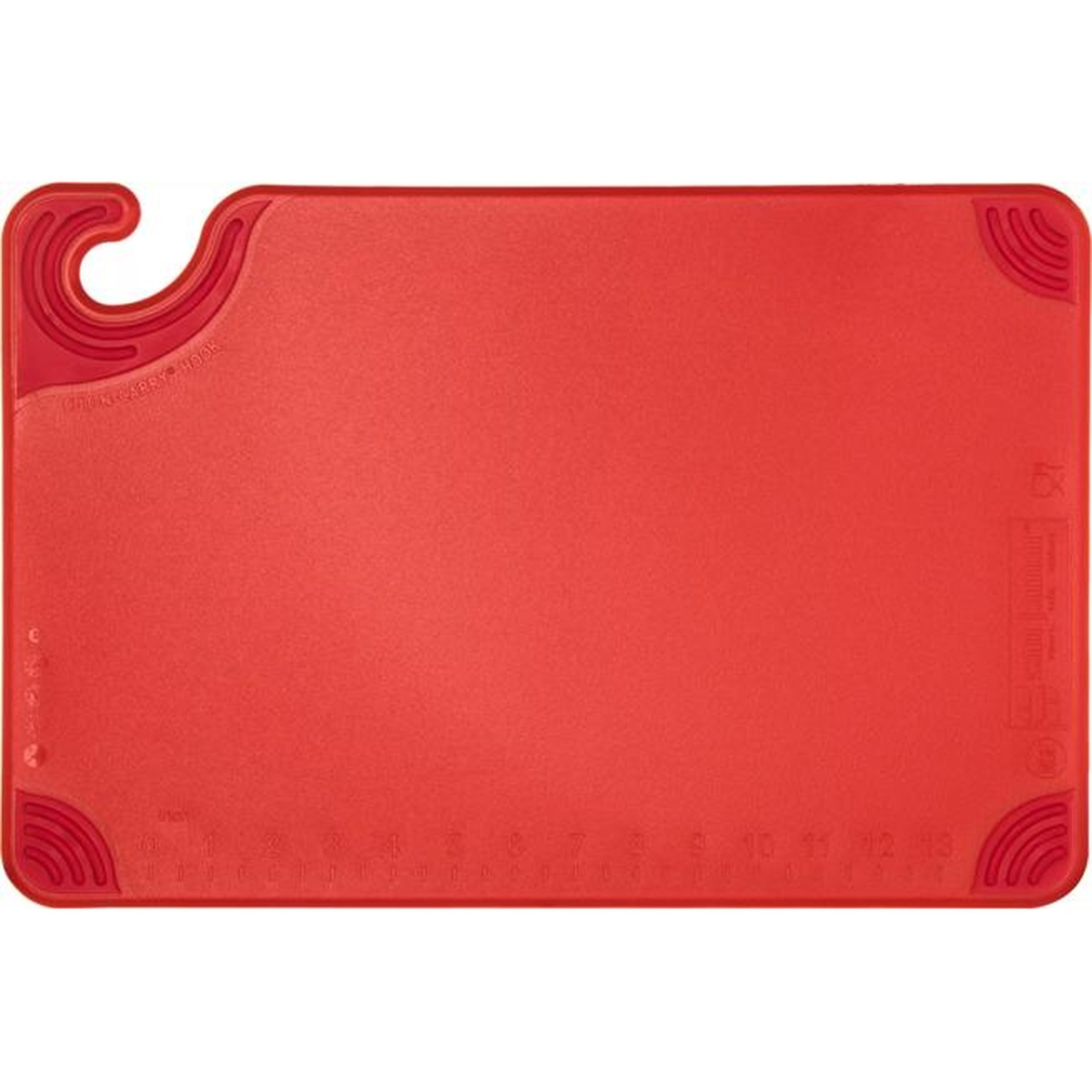 Top-down view of red Saf-T-Grip cutting board showing molded-in ruler markings and anti-slip grip corners