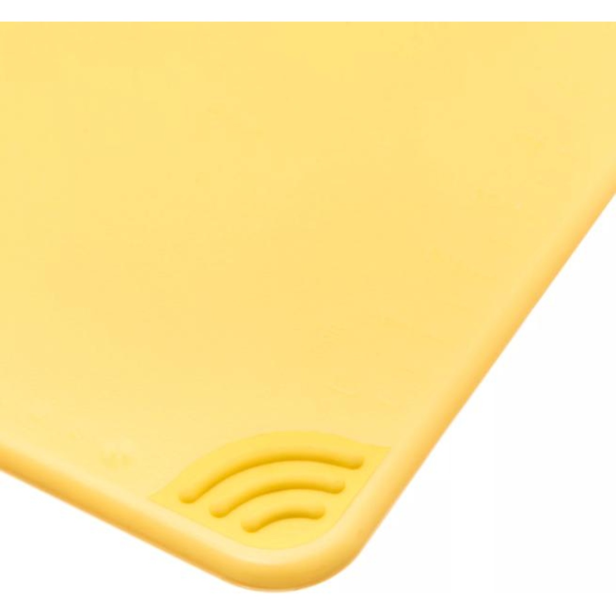 Close-up of the anti-slip grip corner detail on the San Jamar yellow cutting board