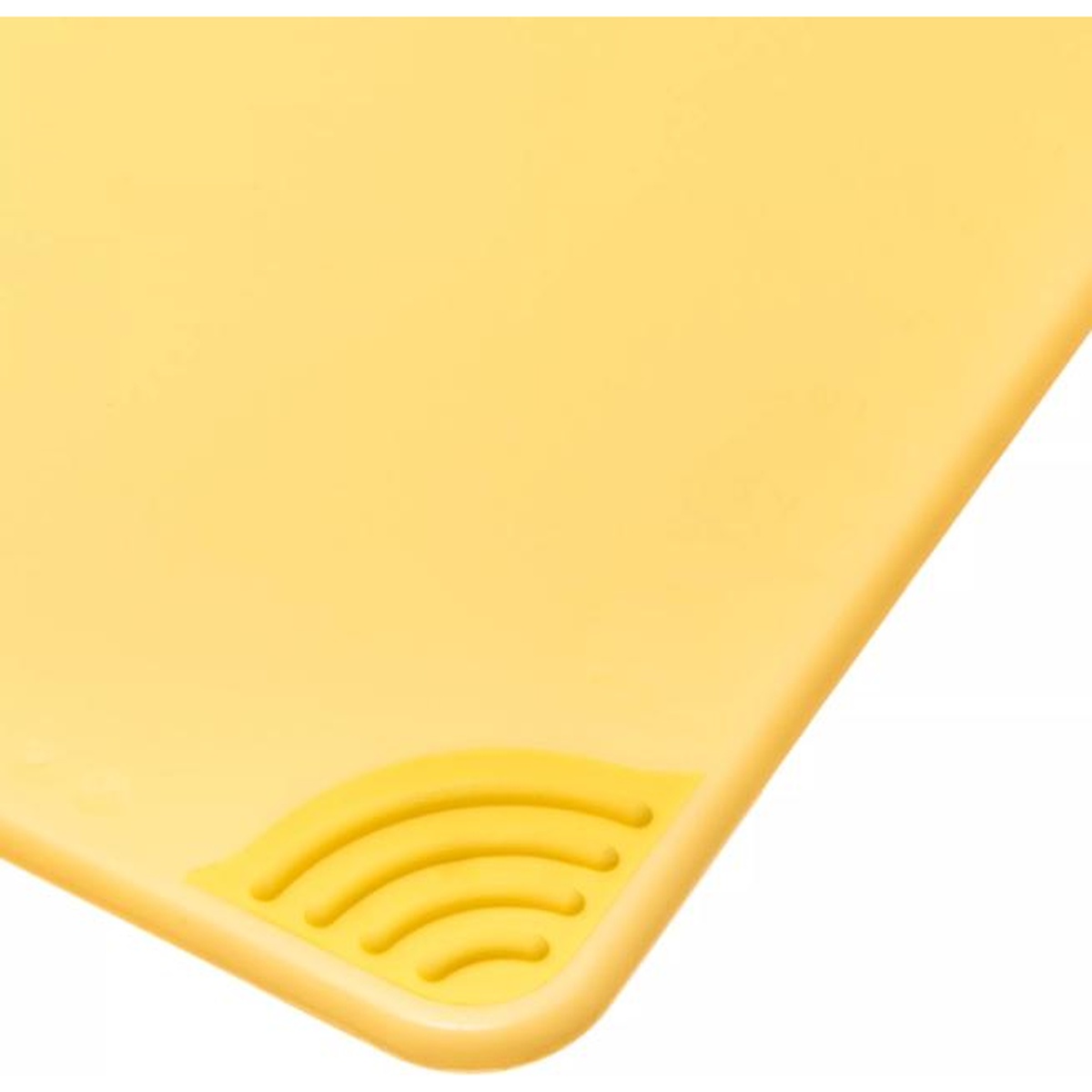 Close-up of anti-slip grip corner detail on yellow San Jamar cutting board