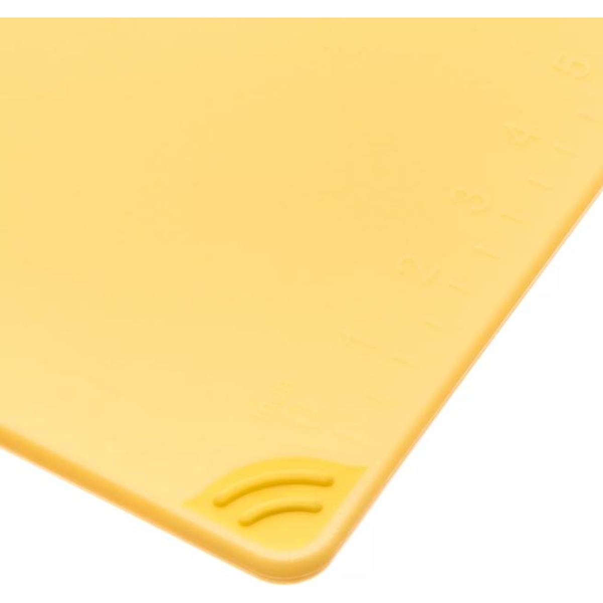 Close-up of anti-slip grip corner and molded-in ruler markings on yellow cutting board