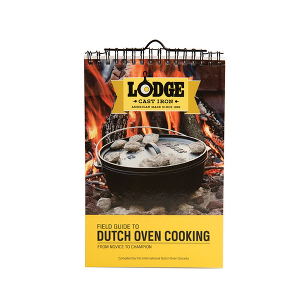 Lodge Cast Iron Field Guide to Dutch Oven Cooking spiral-bound cookbook, front cover showing a Dutch oven over an open fire