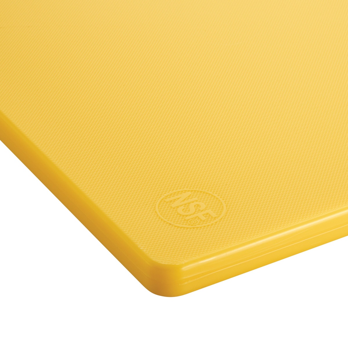 Close-up corner detail of Winco yellow cutting board showing NSF certification mark embossed on textured surface
