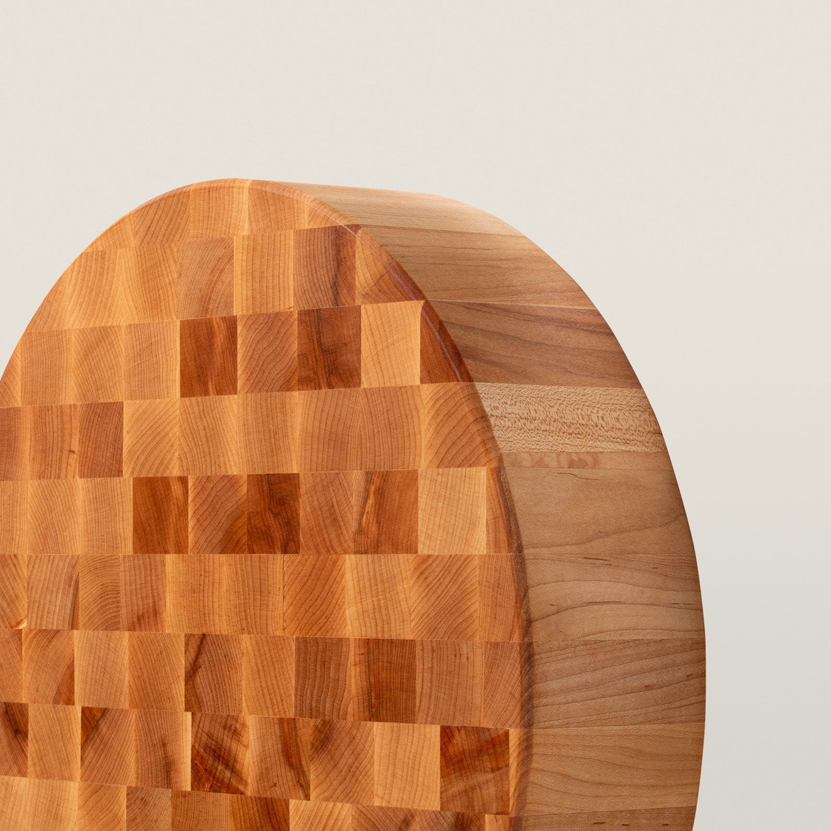 Close-up detail of the end grain top surface and smooth maple side of the John Boos CCB18-R round chopping block