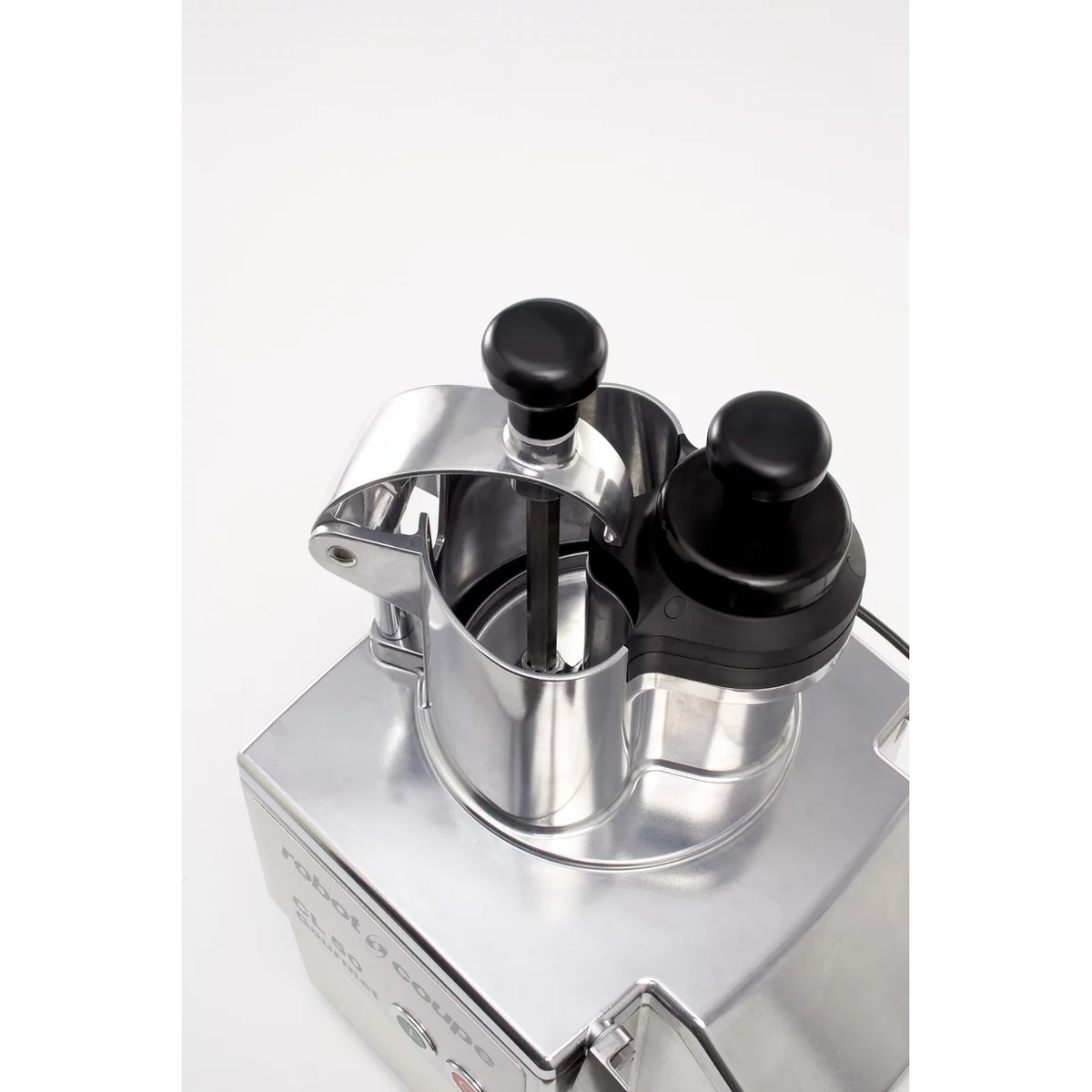 Dual hopper and pusher assembly with kidney-shaped and cylindrical openings