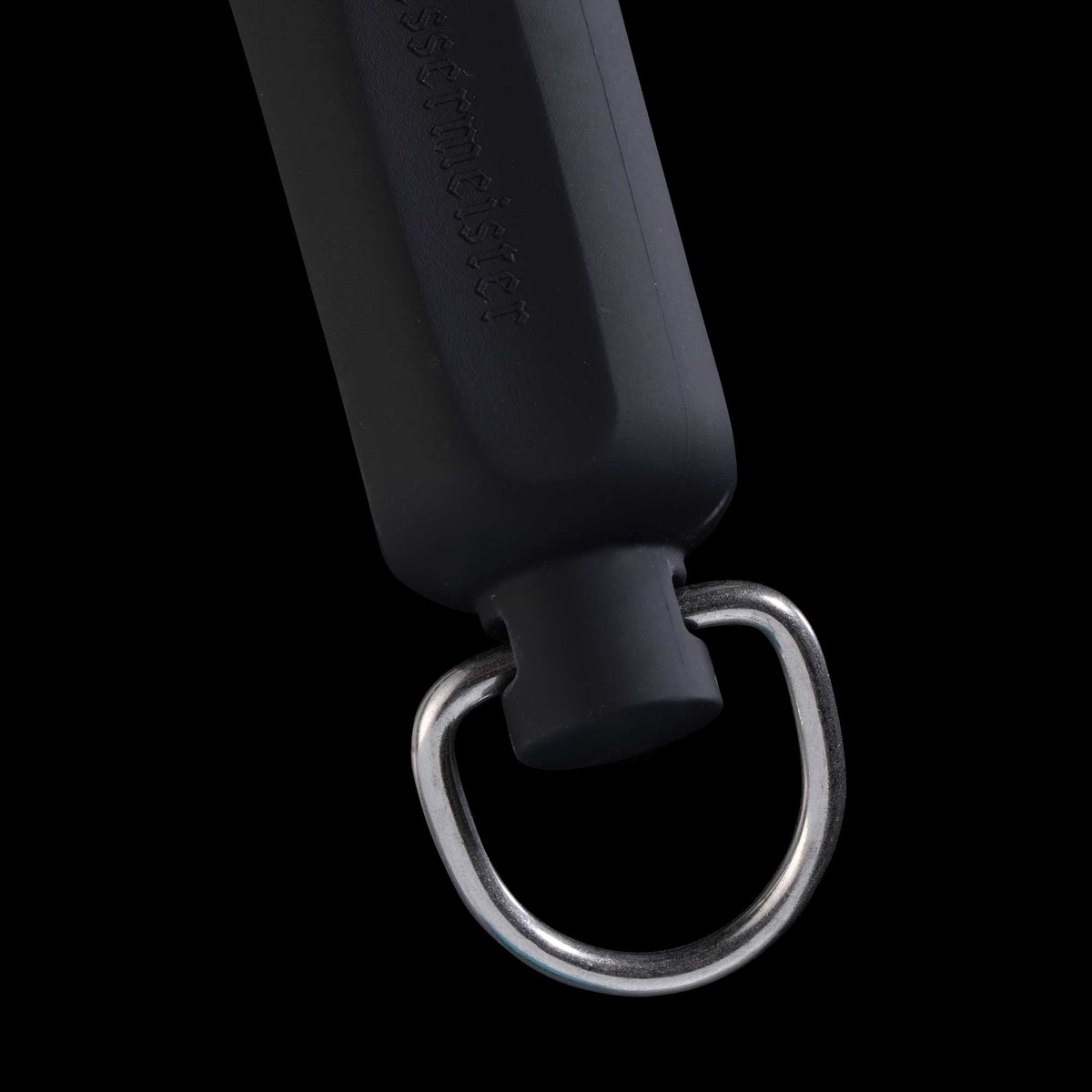 Close-up of the metal hang ring at the base of the Messermeister sharpening rod handle with Messermeister branding embossed on handle