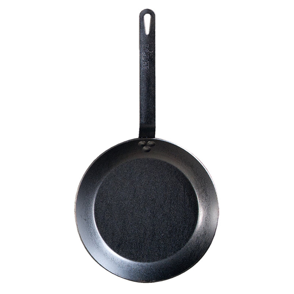 Lodge carbon steel skillet top-down view showing pre-seasoned cooking surface and Lodge-branded handle