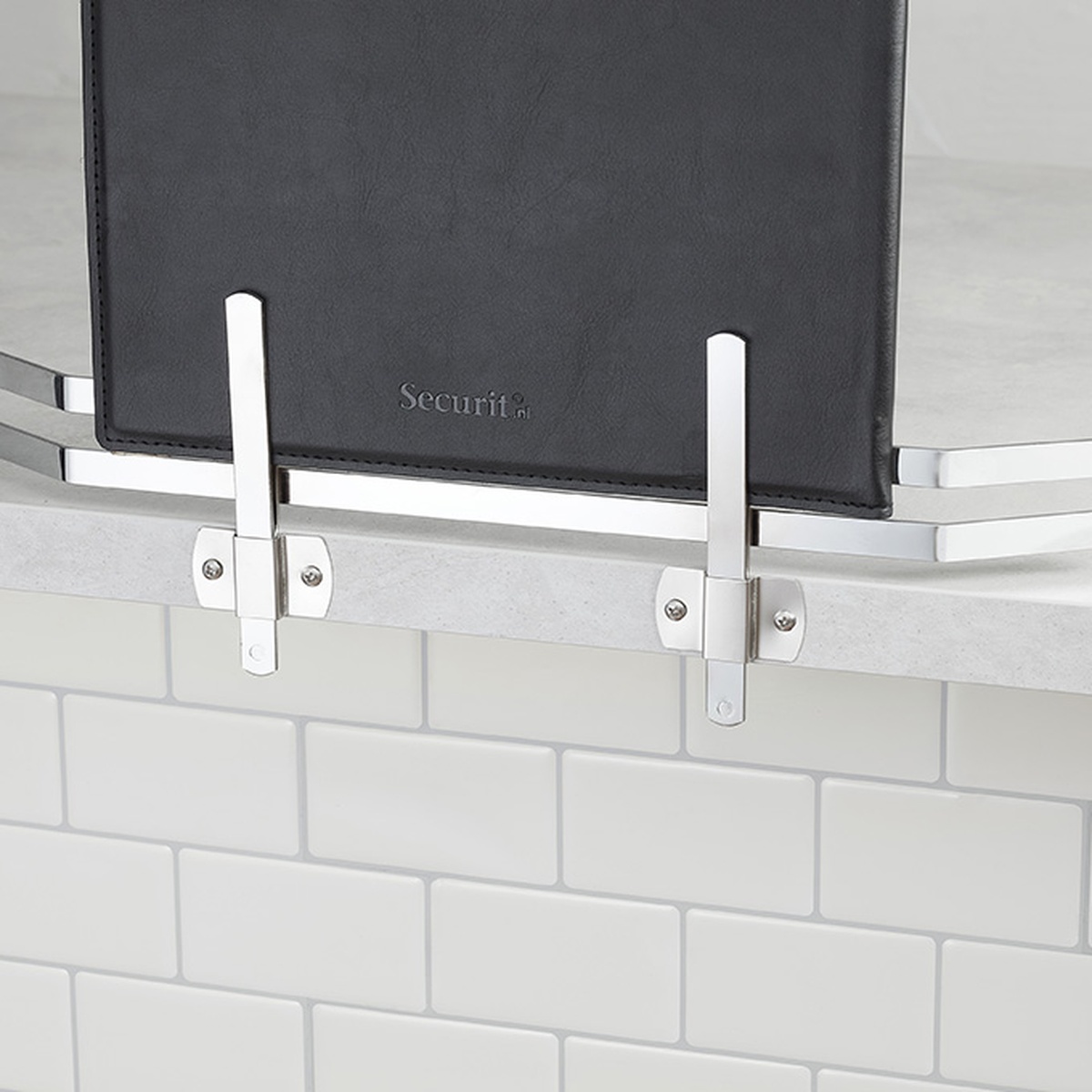 Close-up of the American Metalcraft CS125 screw-on mounting bracket securing the holder to a counter ledge