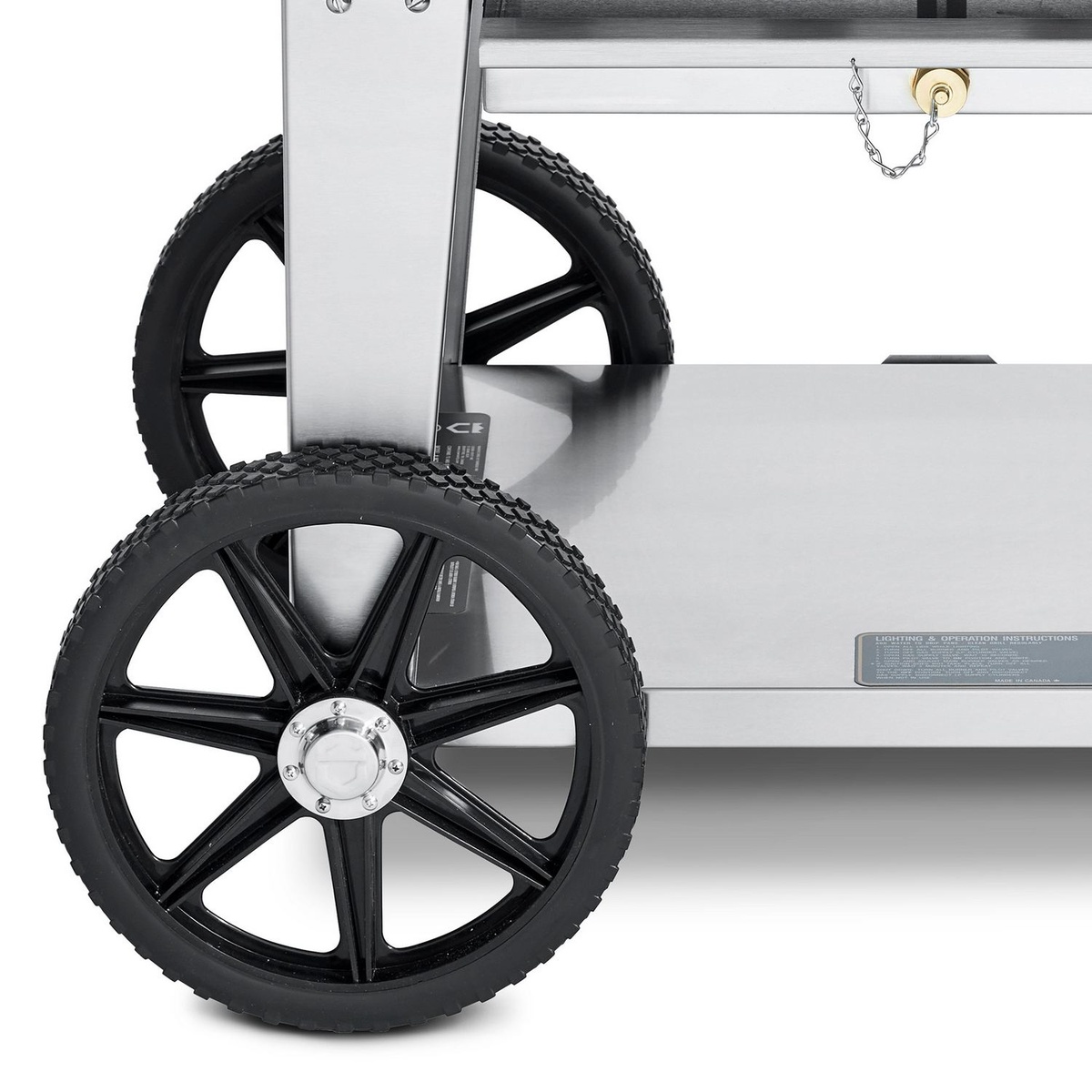 Close-up of the grill cart wheels and stainless steel undershelf