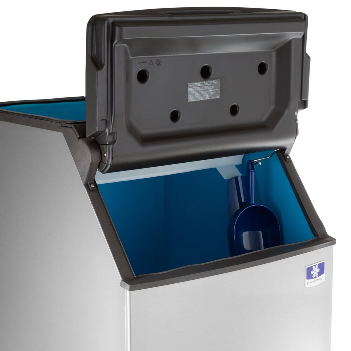 Close-up of Manitowoc D400 ice bin interior showing arctic blue polyurethane liner, built-in scoop holder, and included ergonomic ice scoop