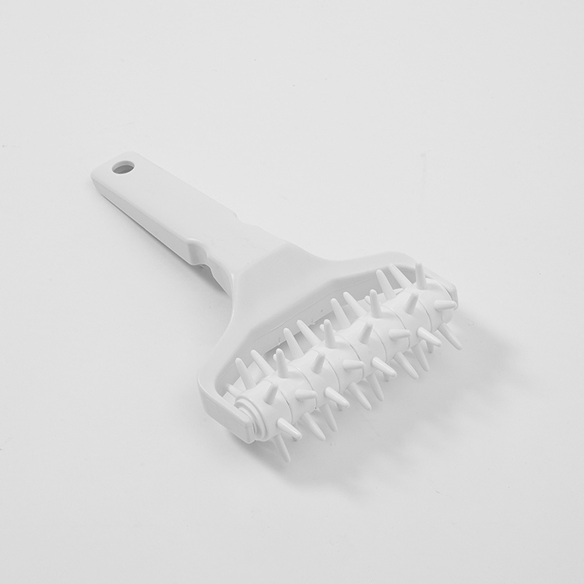 American Metalcraft DD5701 white ABS plastic dough docker with spiked roller wheel and handle