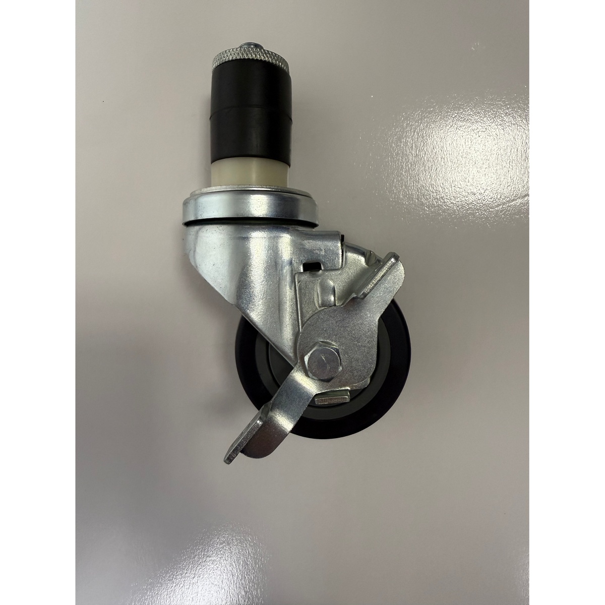 Enhanced 3-inch swivel caster with expanding stem and foot brake, showing polypropylene wheel center and polyurethane tread