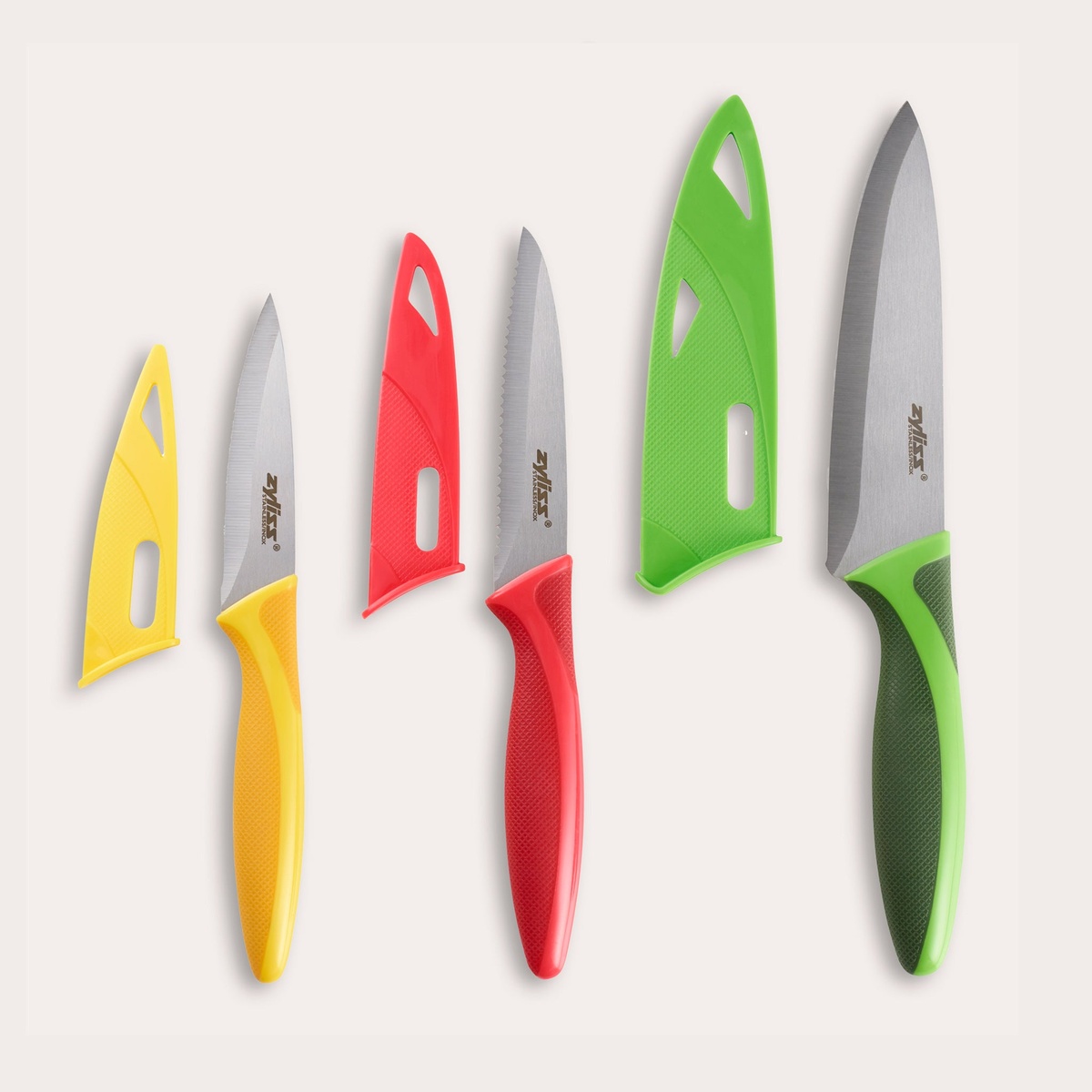 Zyliss 3-piece knife set with yellow, red, and green handles shown alongside their matching protective blade covers
