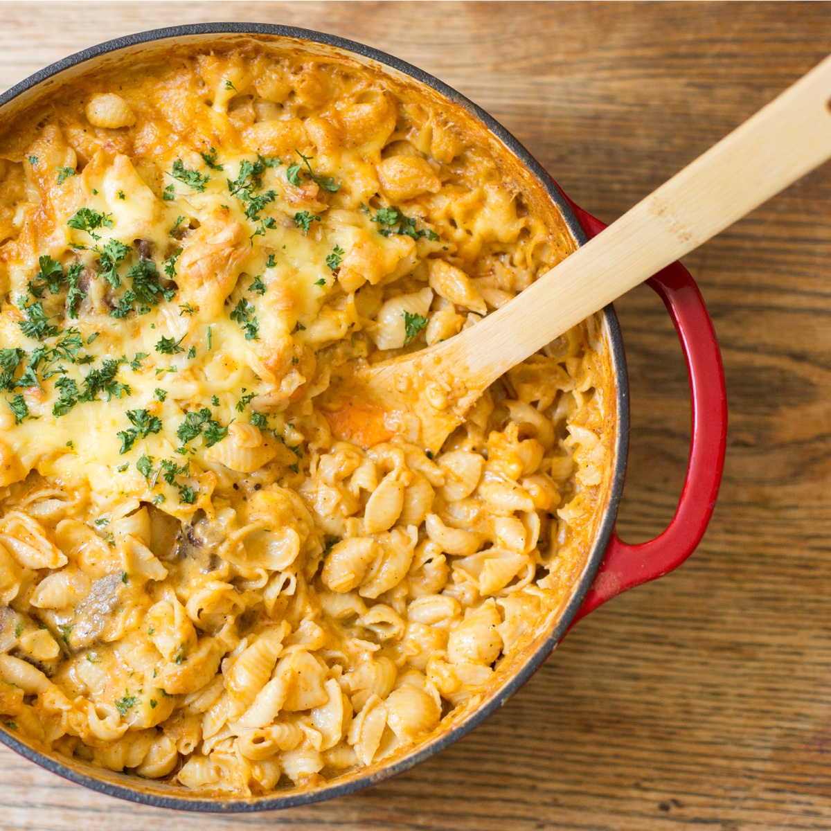 Baked pasta dish inside a red Lodge enameled cast iron pot