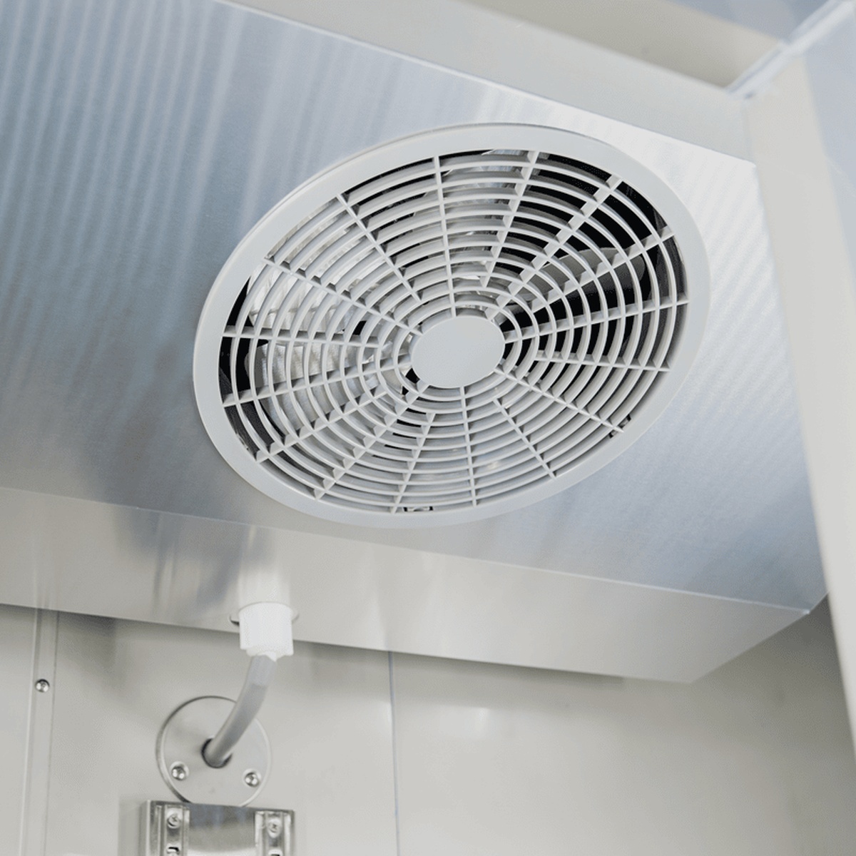 Interior evaporator fan assembly inside the refrigerator