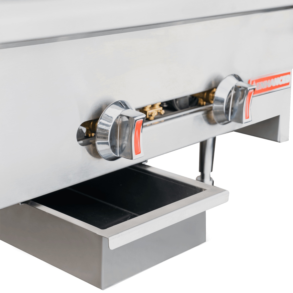 Close-up of the dual manual gas control knobs and pull-out grease drip tray on the Enhanced EHDG-24 griddle