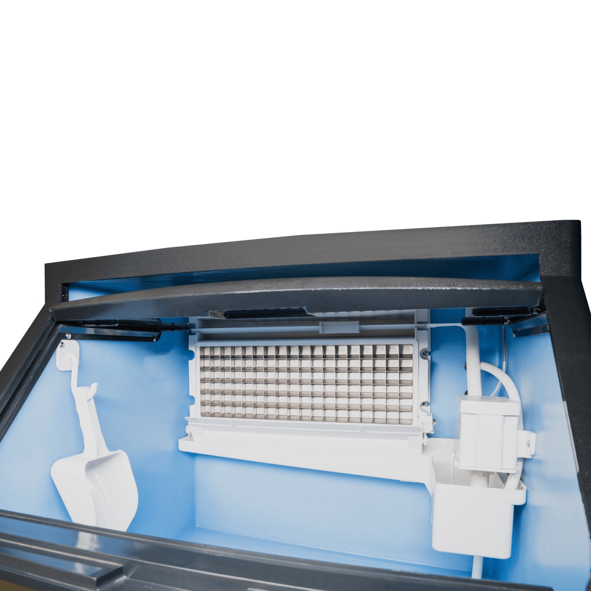Interior view of ESK-129S showing half-cube ice mold evaporator grid, ice scoop, and blue-lined bin compartment