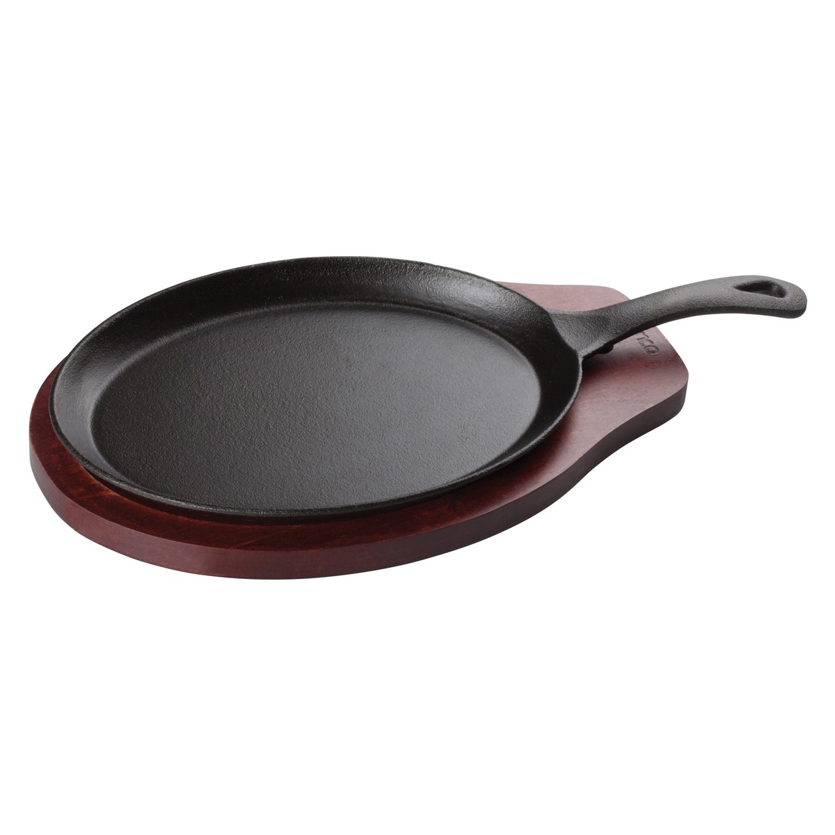 Winco FS-2 black oval cast iron fajita skillet resting on a dark wood underliner board