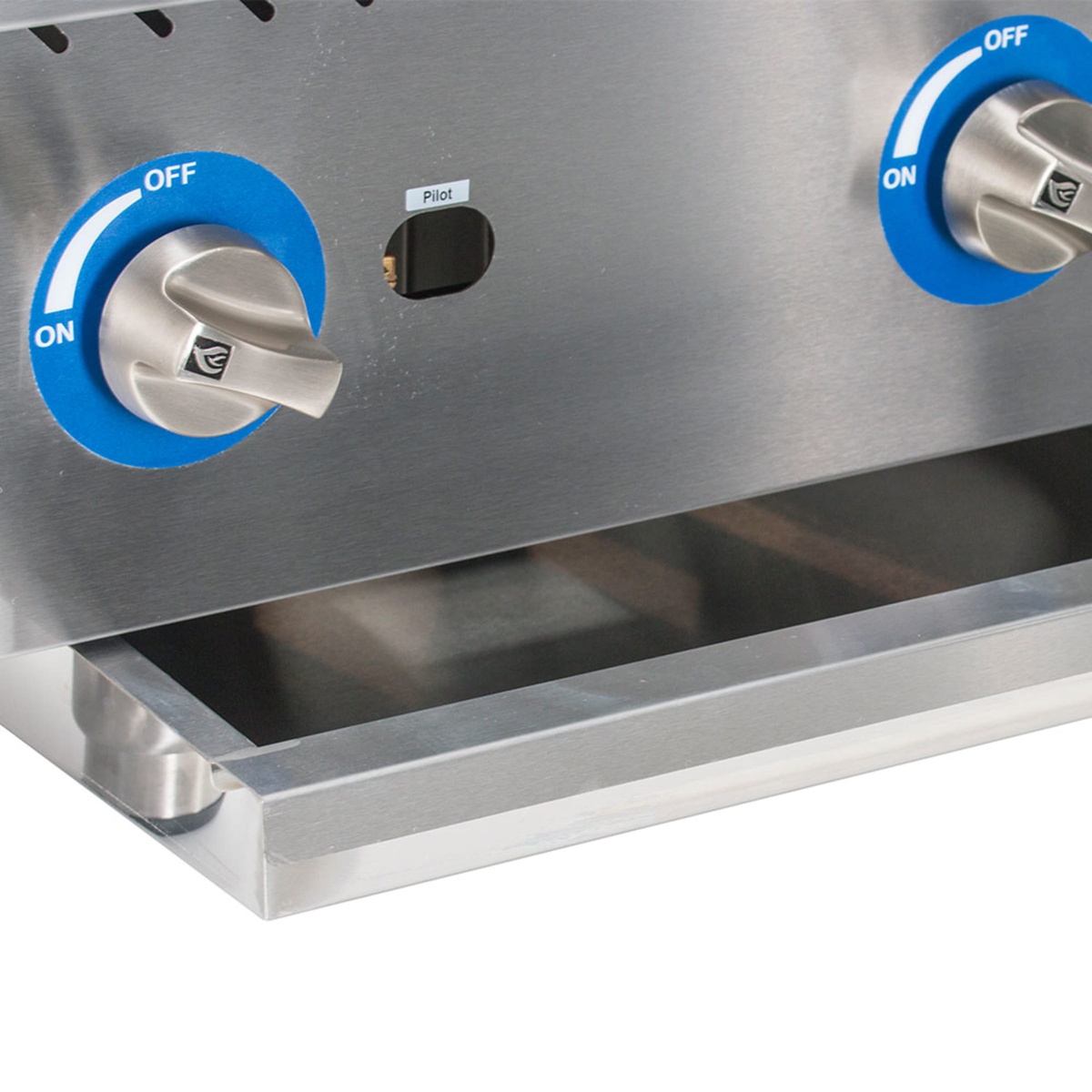 Close-up of Globe GCB24G-SR control knobs and removable drip tray