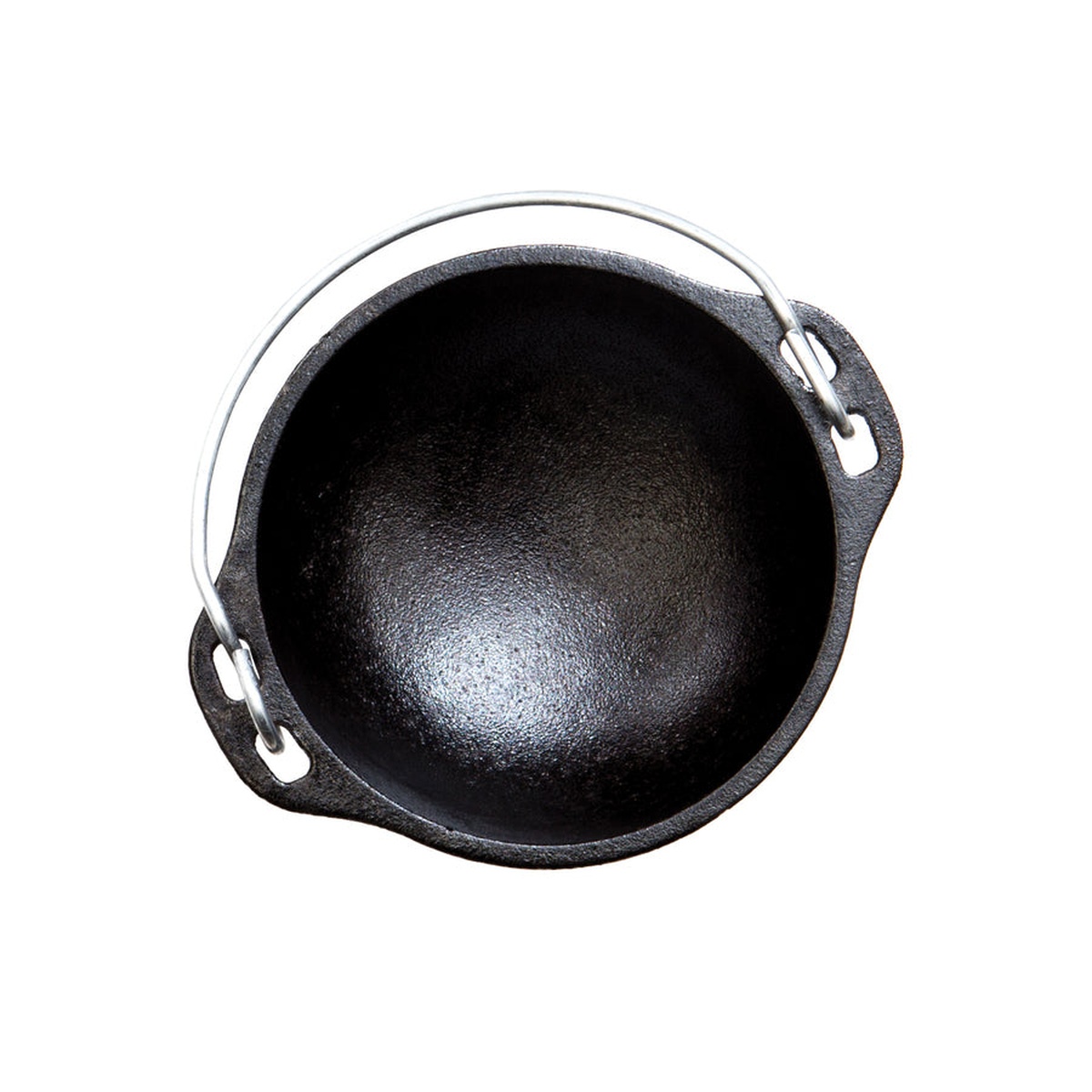 Top down view of the interior of a seasoned cast iron mini kettle