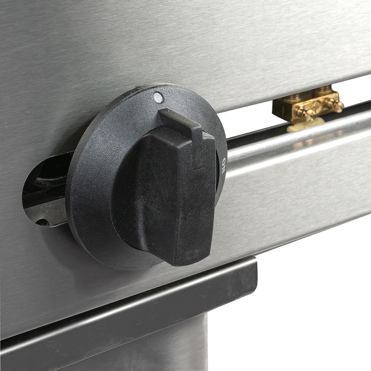 Close-up of Wells griddle manual control knob on front panel