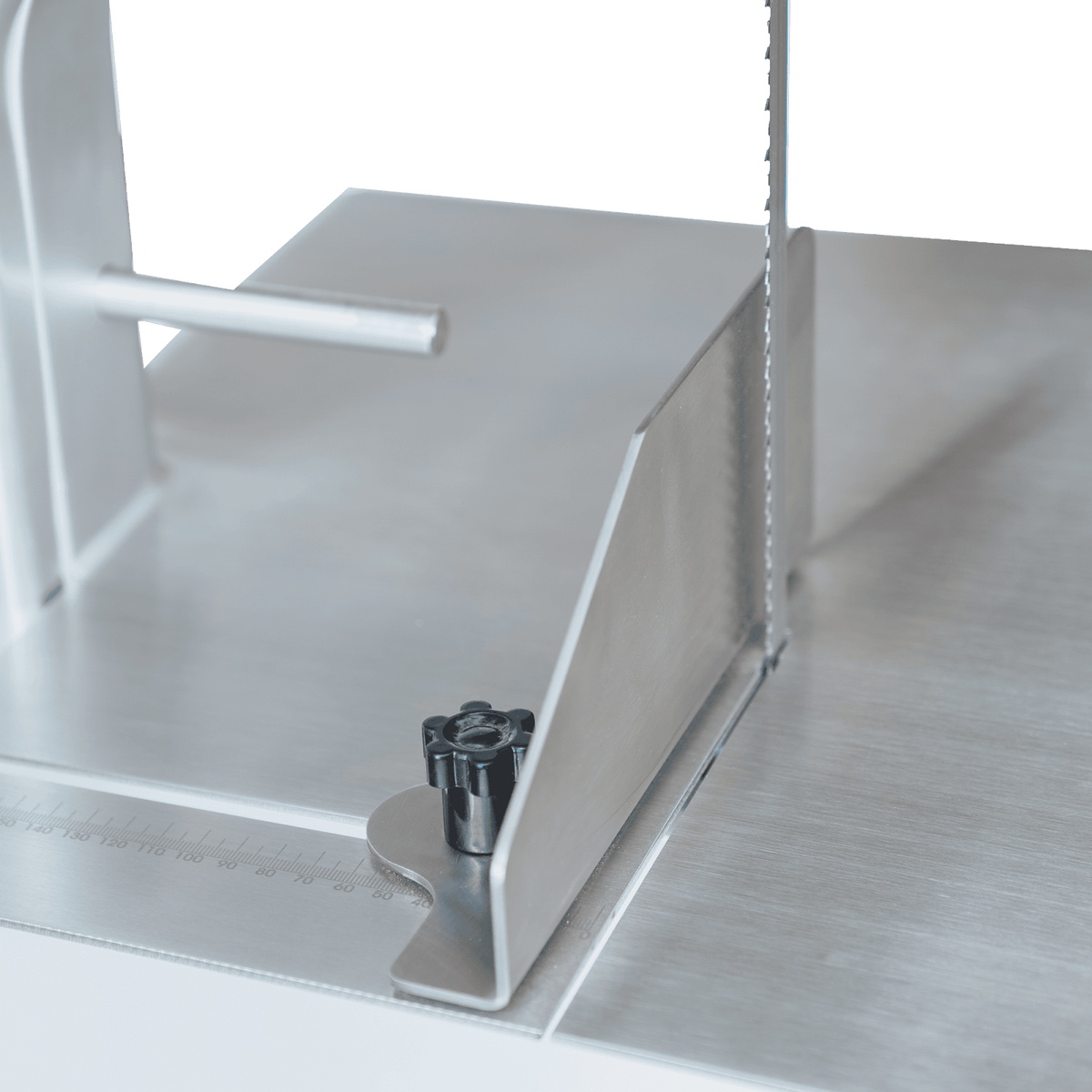 Close-up of the HLS1650A adjustable fence with locking knob and measurement scale on the cutting table
