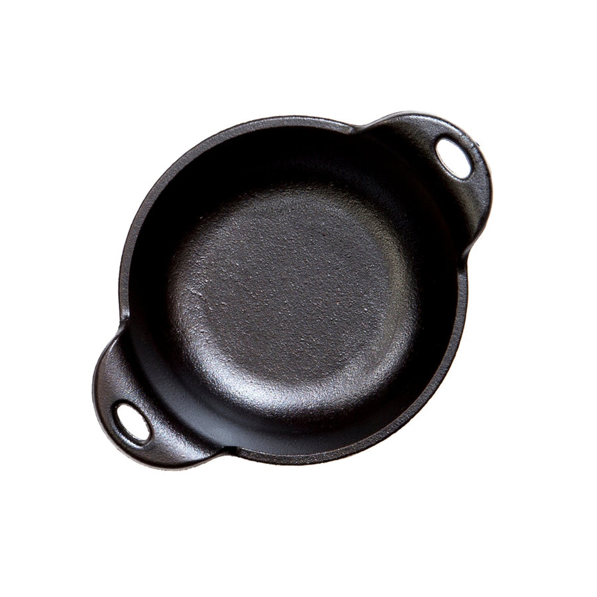 Top-down view of the pre-seasoned interior of the Lodge mini serving bowl