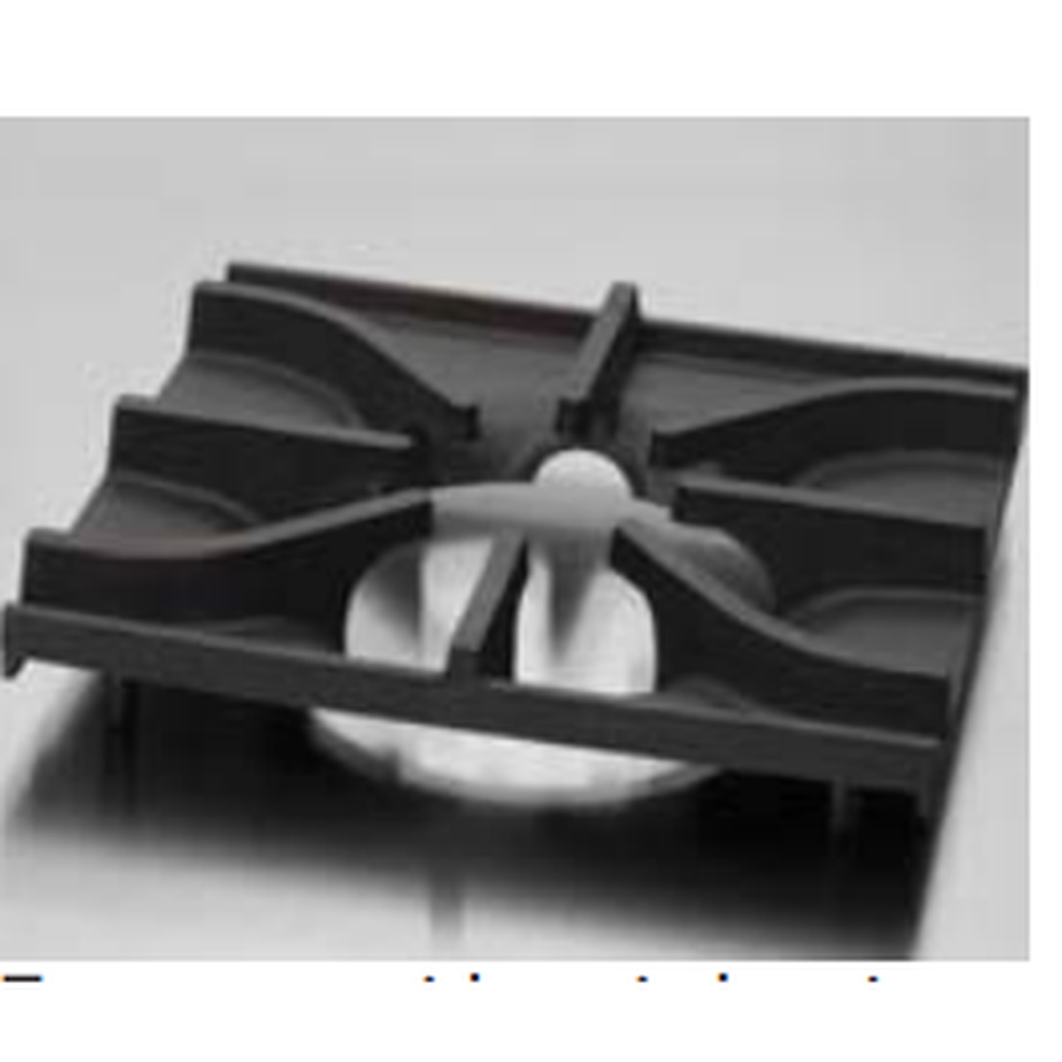 Close-up of cast iron burner grate on Imperial range