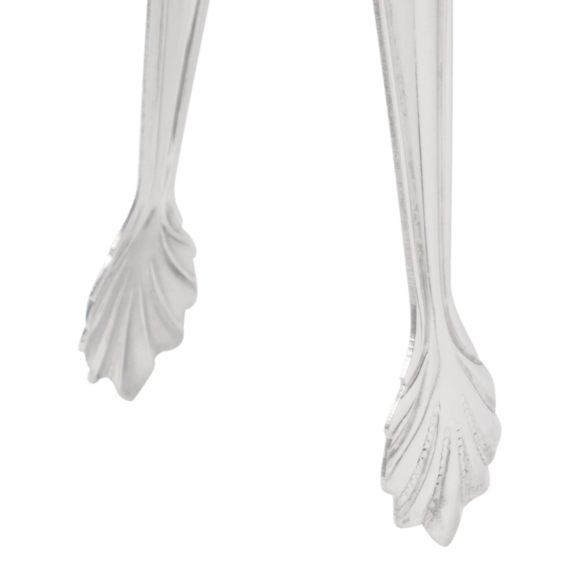 Close-up of American Metalcraft IT400 sugar tong tips showing ornate decorative leaf-shaped gripping ends