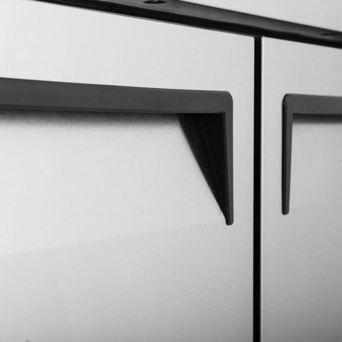 Close-up of recessed handles on Turbo Air JUF-48-N stainless steel freezer doors