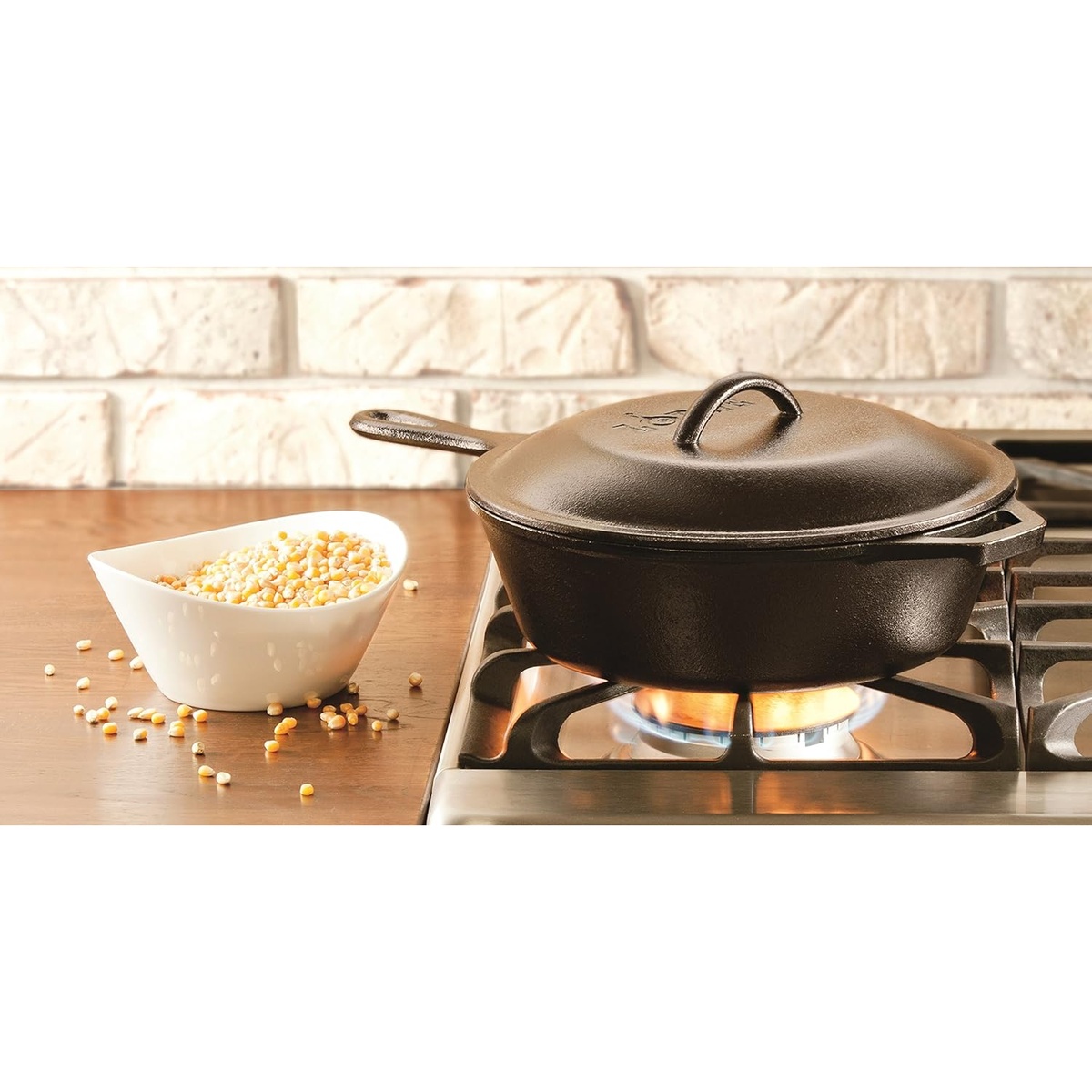 Lodge cast iron lid on a pot over a gas stove flame