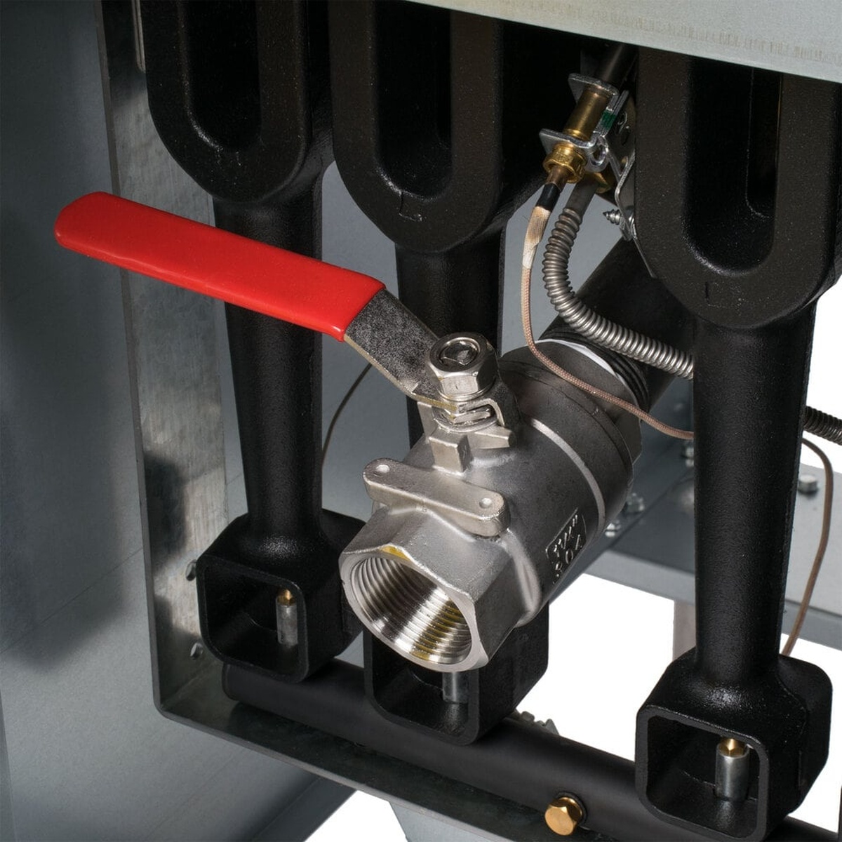 Close-up of Vulcan LG400 full-port drain valve under the fryer