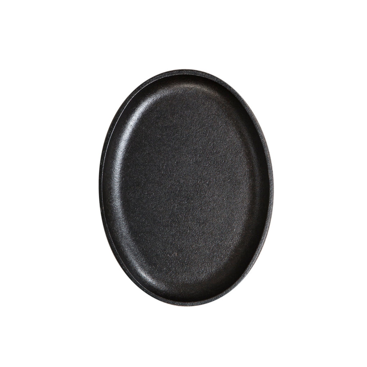 Lodge Jumbo Oval Cast Iron Serving Griddle top-down view showing the full seasoned cooking surface