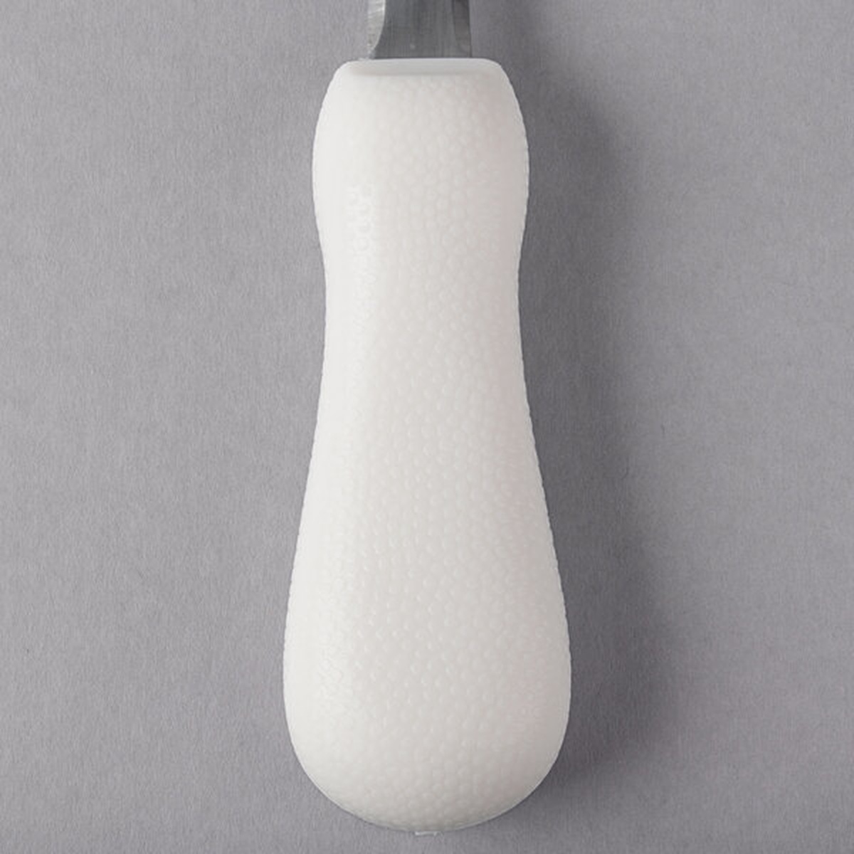 Close-up of the white textured polypropylene handle of the Mercer Culinary oyster knife showing ergonomic shape and non-slip texture