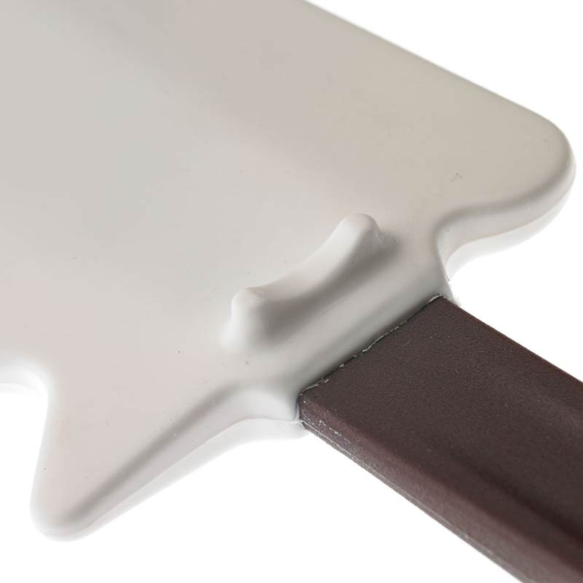 Close-up of the molded kickstand on the underside of the Hell's Tools silicone spatula blade where it meets the handle
