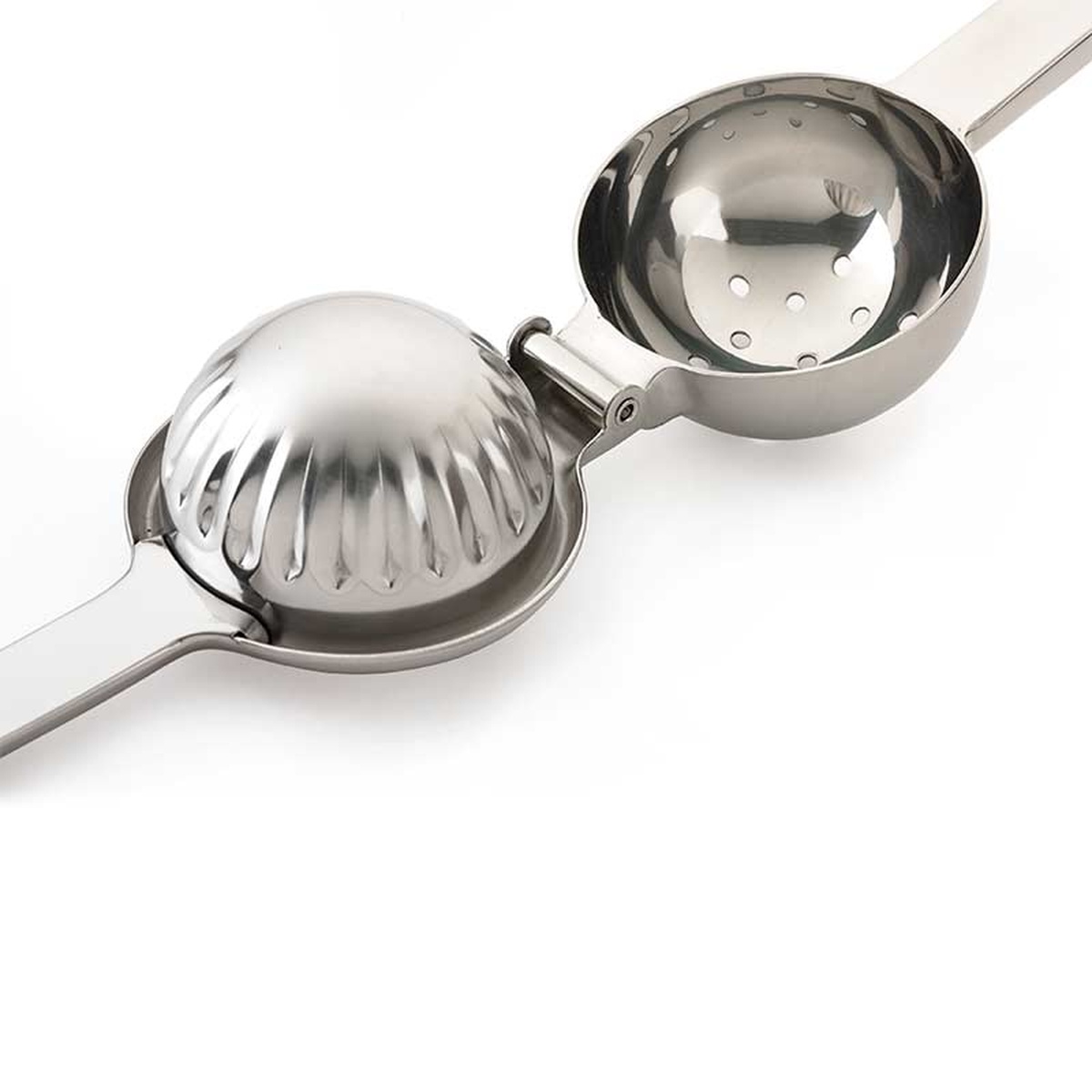 Close-up of Barfly Deluxe Juicer open, showing the ribbed pusher and perforated bowl halves